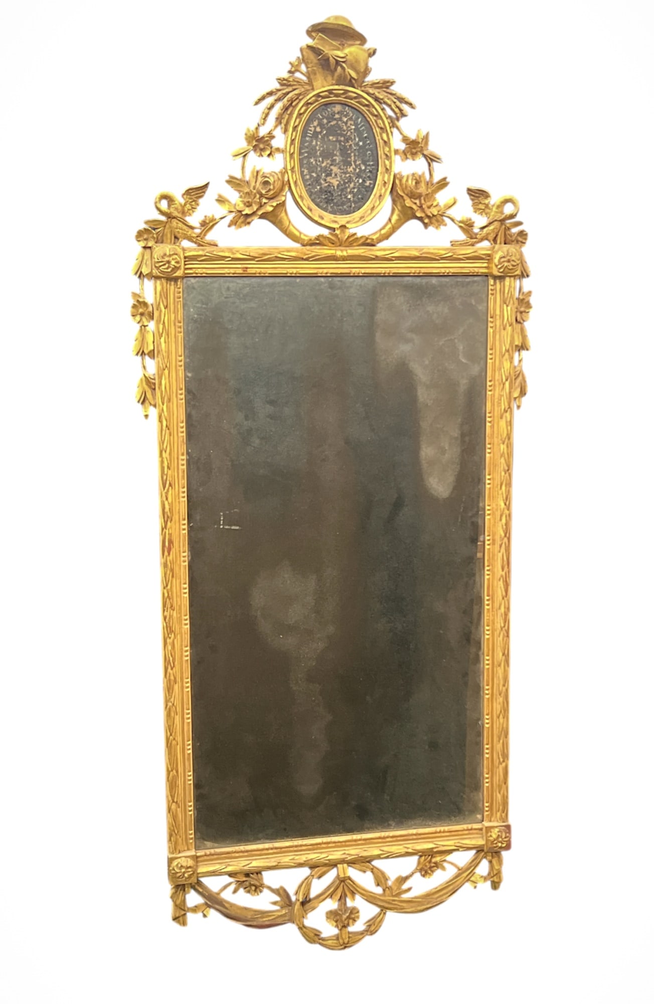 GEORGE WASHINGTON -THE MEMORY of his EXCELLENCY: Reverse painting on glass 6 x 4 1/2 inches surmounting an antique mirror and frame carved with sheaves of wheat, cornucopia, phoenix, flowers and draped swags. 51 x 22 inches