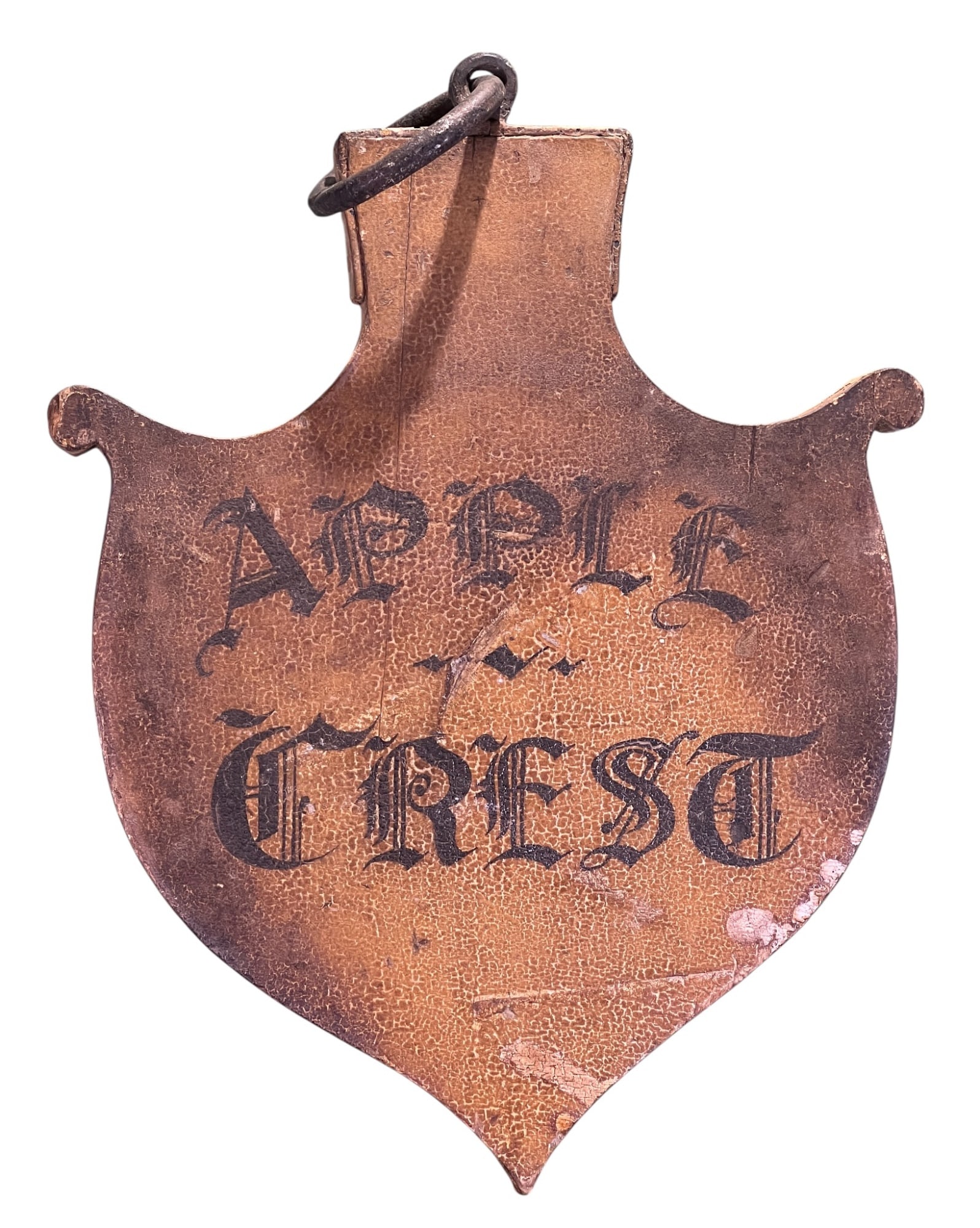 (19th c) CARVED & PAINTED APPLECREST SIGN: Single sided carved shield form sign with gothic lettering and sturdy iron ring hanger. 18 1/2 x 15 1/4 inches. Condition: Weathered, craquelure, surface grime. Temp No 8394