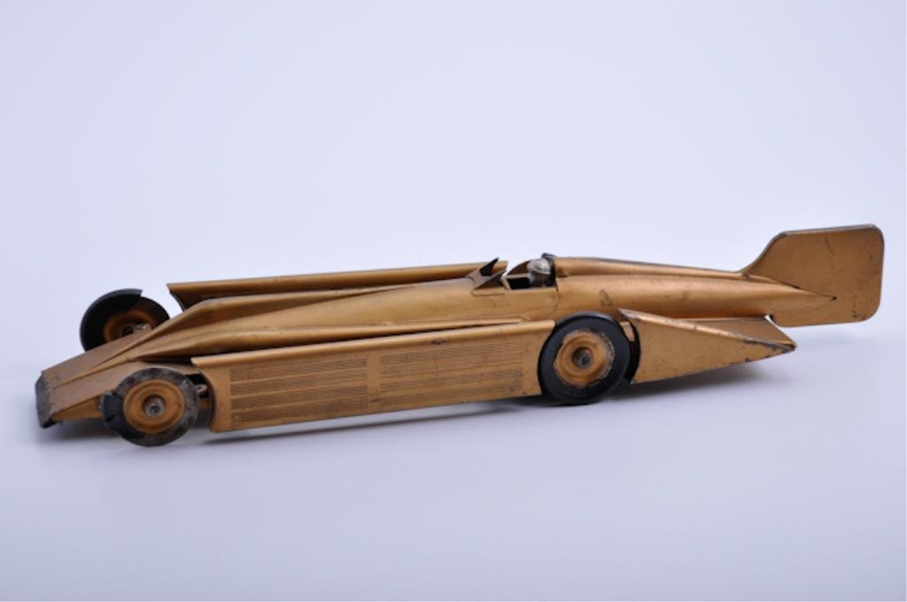 Early 19th C Kingsbury Motor Driven Race Car: wind up. 20"l. Condition: rubber tires have losses, windshield is damaged, wear to gold paint
