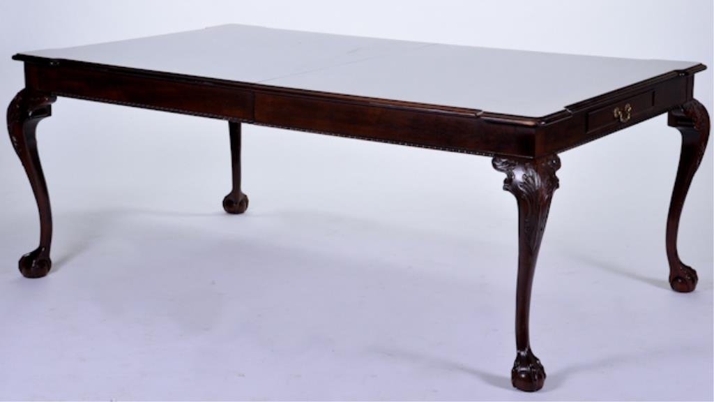 Henredon Chippendale Style Dining Room Table: Mahogany, two drawers, two 24" leaves and pads (matches lot 57) 76"l x 46"w. Condition: good, minor surface wear to knees