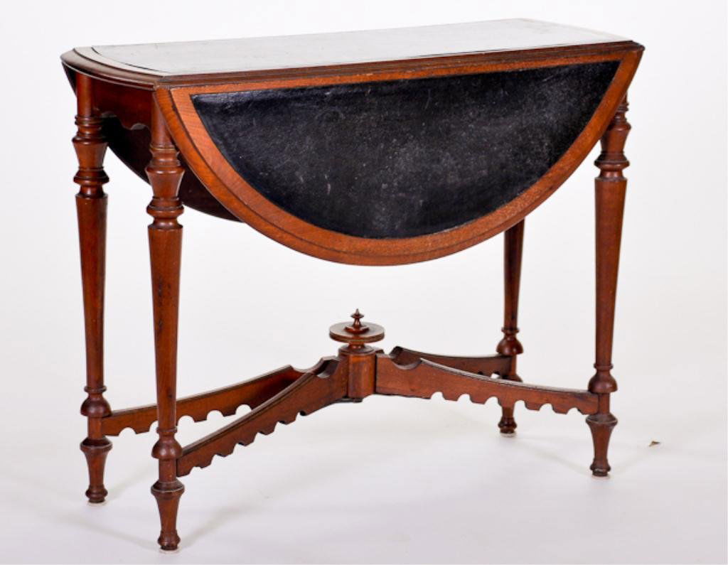 Custom Leather Top Drop Leaf Table: On turned legs with spring opening mechanism.