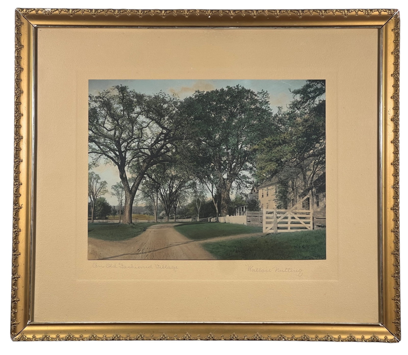WALLACE NUTTING (1861-1941) Connecticut Scene: "An Old Fashioned Village", hand colored photograph, hand signed & titled. 18 1/2 x 21 1/2 inches overall. Location: (Southbury, CT)