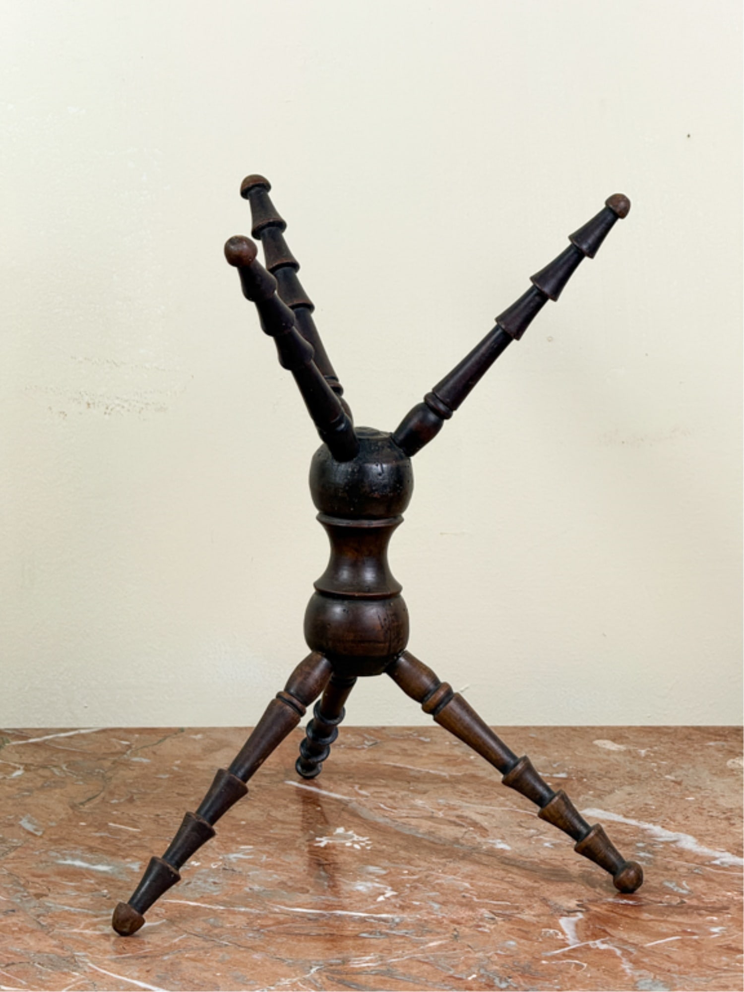 FINELY TURNED (19thc) MAHOGANY CAT: Turned center column with (3) feet and arms. 12 1/4 inches.