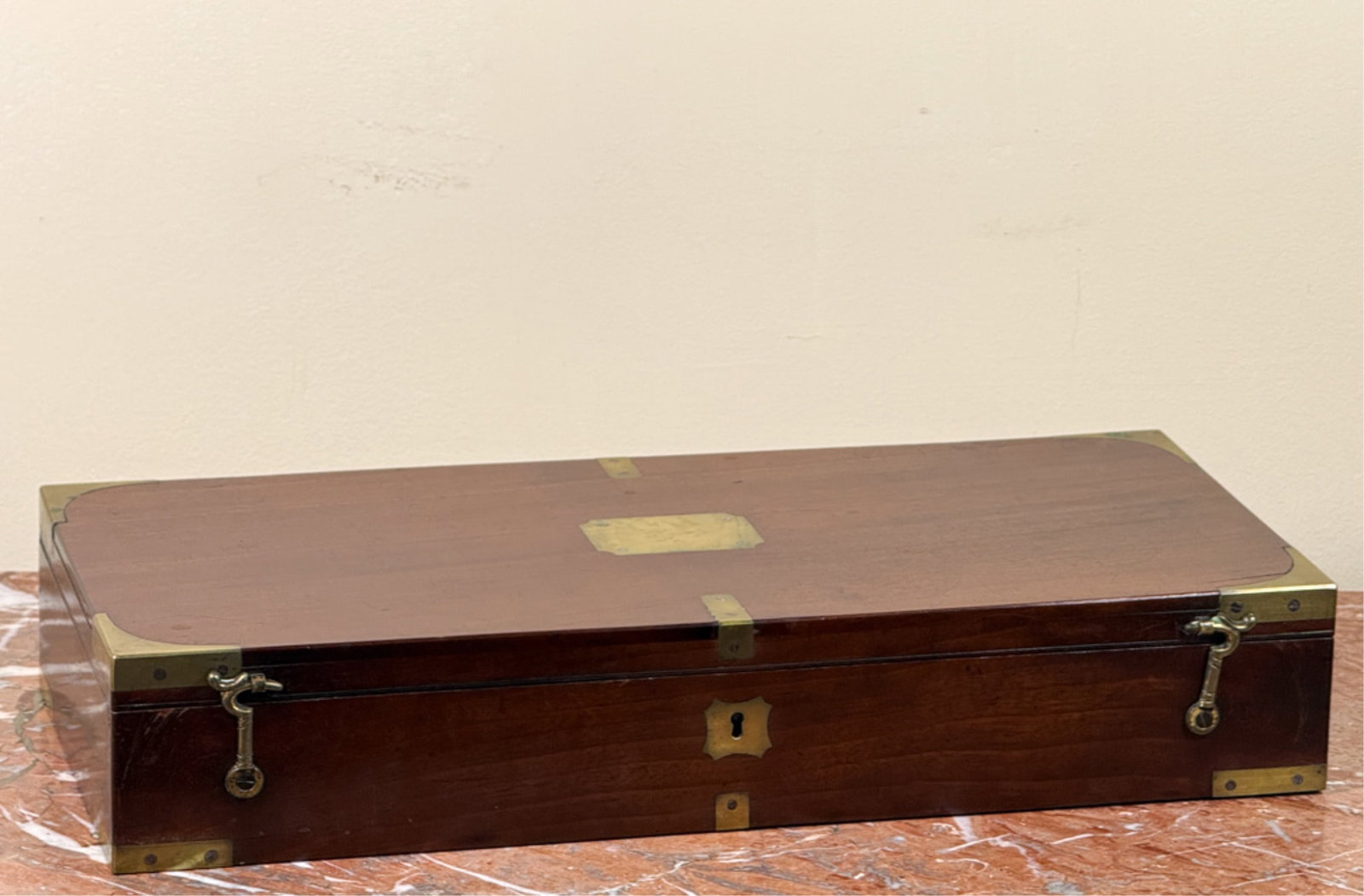 (19thc) BRASS BOUND MAHOGANY PISTOL BOX: Brass corner with blank name plate. 3 1/2 x 18 3/4 x 8 1/4 inches.