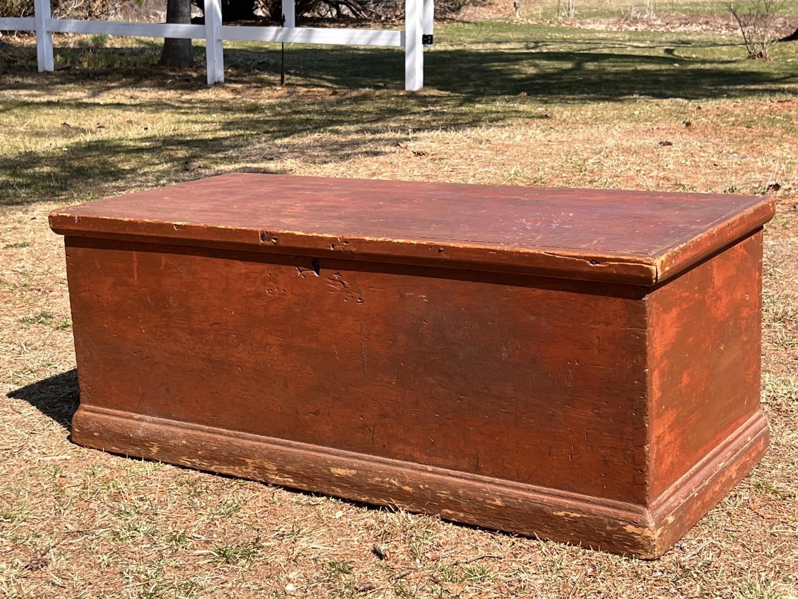 (19th c) SIX BOARD CHEST IN OLD RED PAINT: Dovetailed construction with original hinges. 17 1/4" x 45" x 19 1/4"
