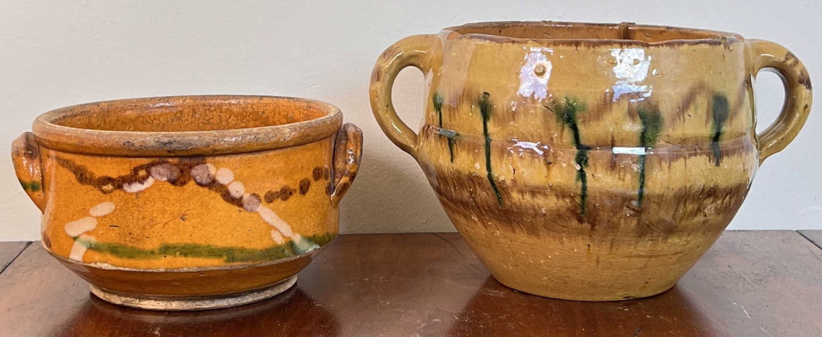 (2) (19th c) GLAZED EARTHENWARE HANDLED POTS: Tallest 5". Unmarked