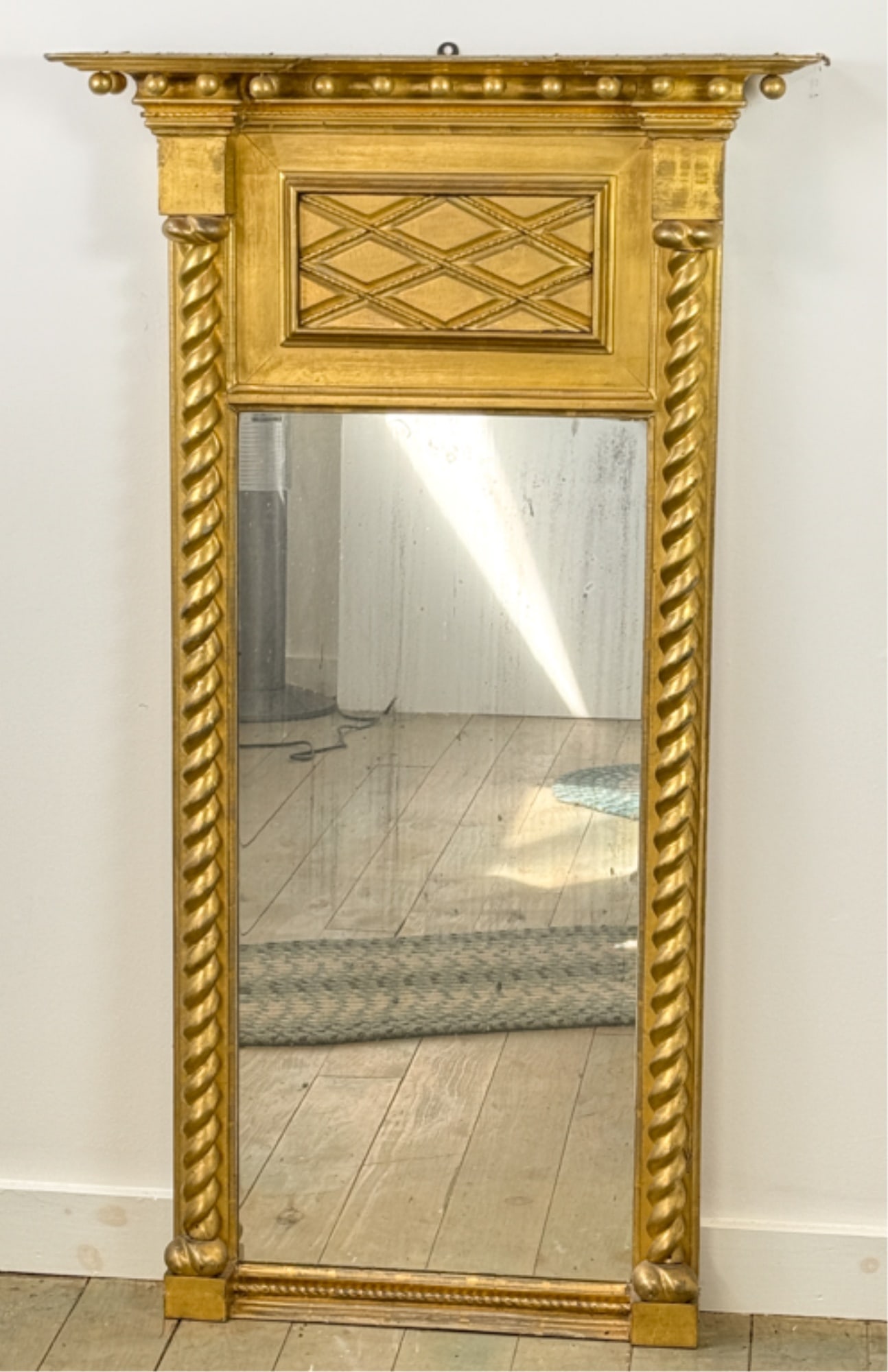 FEDERAL TWIST COLUMN GILTWOOD MIRROR: With original glass and lattice decorated frieze. 49 x 27 1/2 inches.