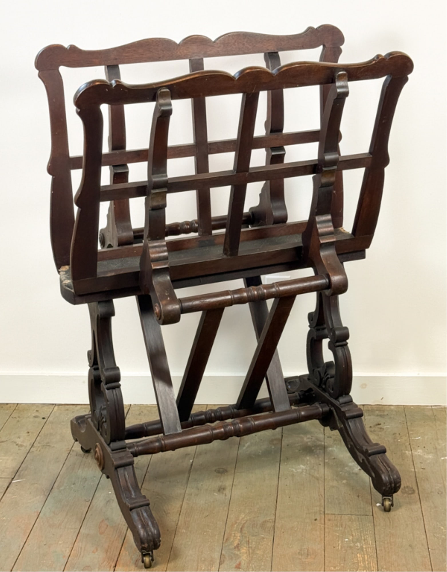 (19thc) CARVED WALNUT PORTFOLIO STAND: Adjustable brackets with leather pad on carved base with turned stretchers. 42 x 30 x 26 inches.