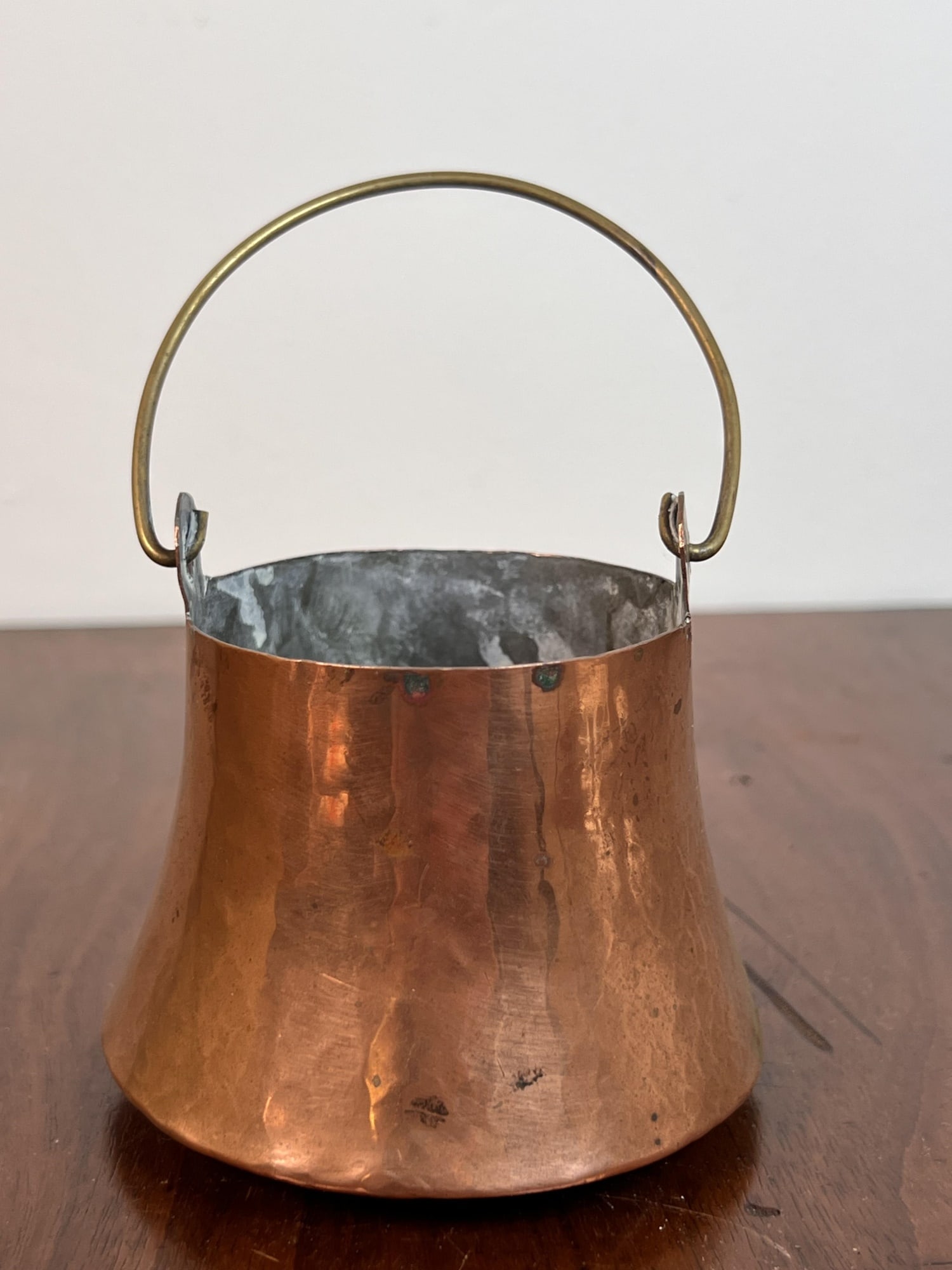 (19th c) HAND HAMMERED MINIATURE COPPER PAIL: With swing handle. 3" tall not including handle