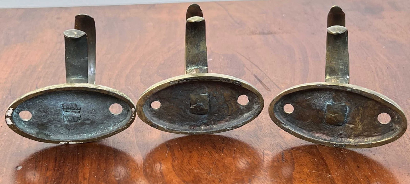 (3) EARLY BRASS JAMB HOOKS - 7