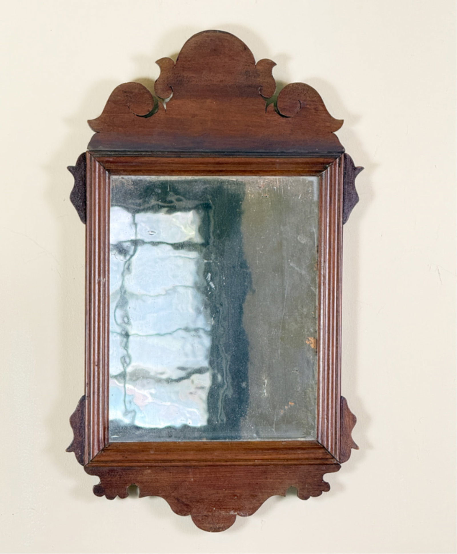 CARVED CHIPPENDALE MAHOGANY MIRROR: With original glass. 20 x 12 inches.