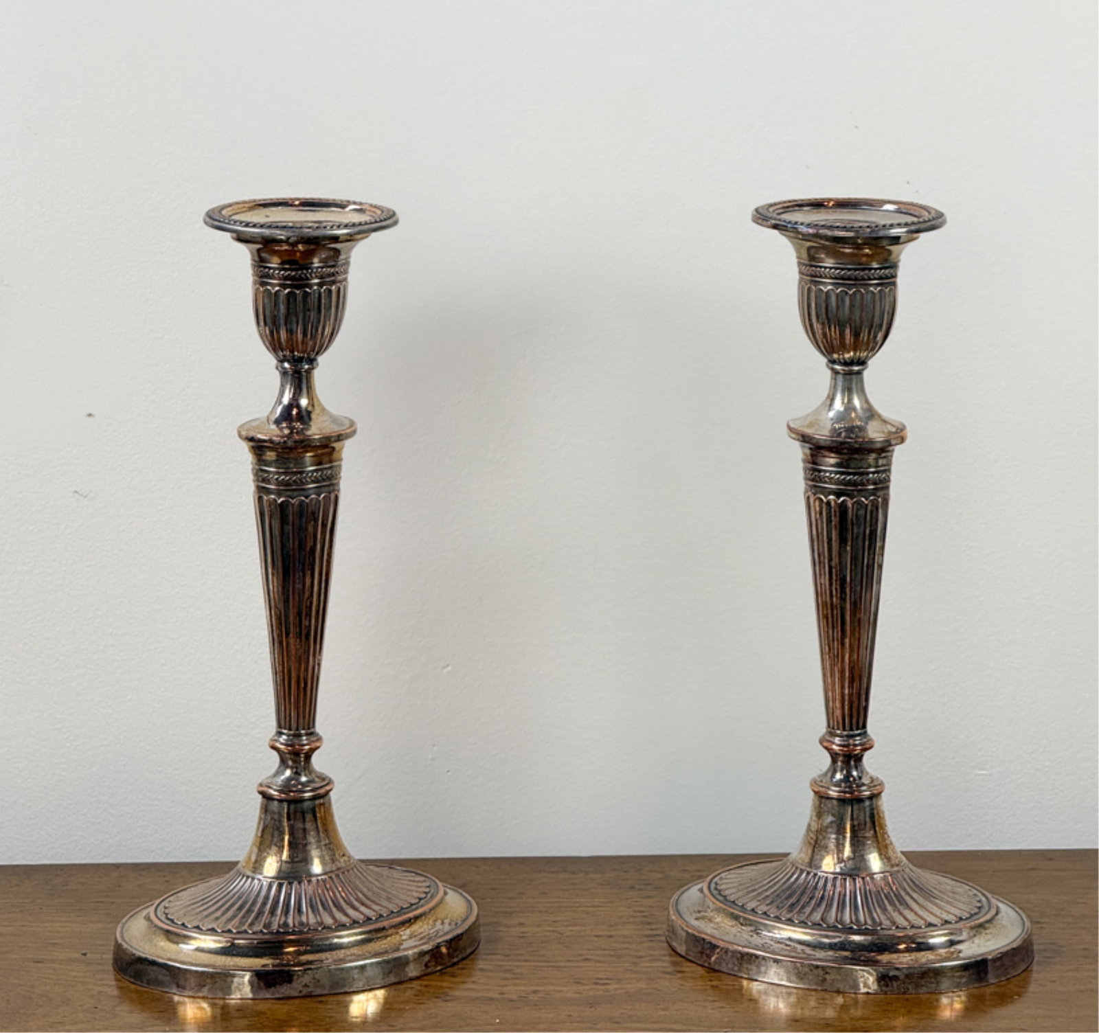 PAIR GEORGE III SHEFFIELD CANDLESTICKS: 11 1/4 inches.