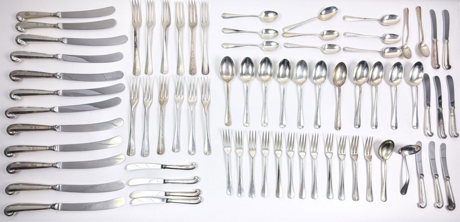 KIRK STIEFF STERLING SILVER FLATWARE SERVICE: Williamsburg Queen Anne. (12) Dinner forks, (12) salad forks, (12) dessert spoons, (11) dinner spoons, soup spoon, sauce ladle, (12) dinner knives and (12) spreaders. Dinner forks measure 7 3/4