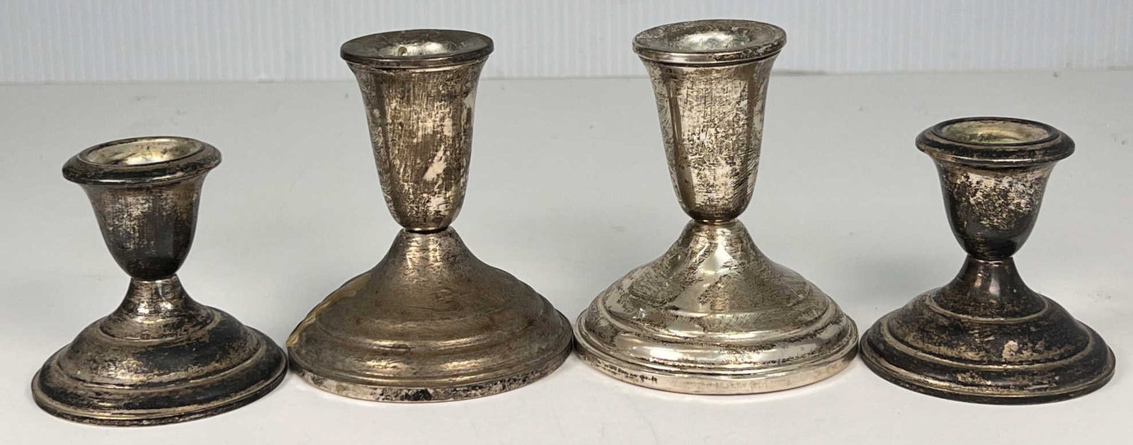 (2) PAIR WEIGHTED STERLING SILVER CANDLESTICKS: Tallest 3 3/4"