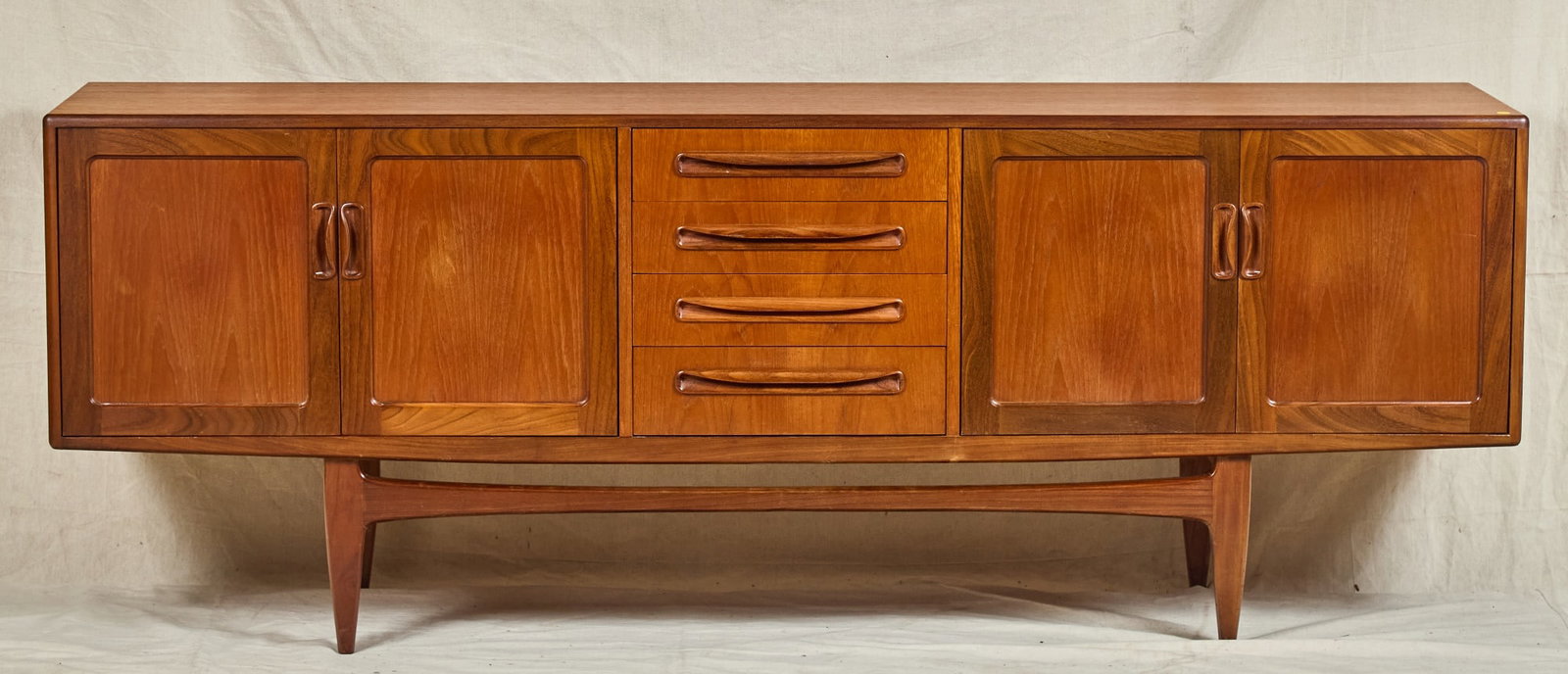 MID-CENTURY G PLAN "FRESCO" CREDENZA: Middle section with (4) drawers flanked by (2) door cabinets on either side. 31 x 84 x 18 inches.