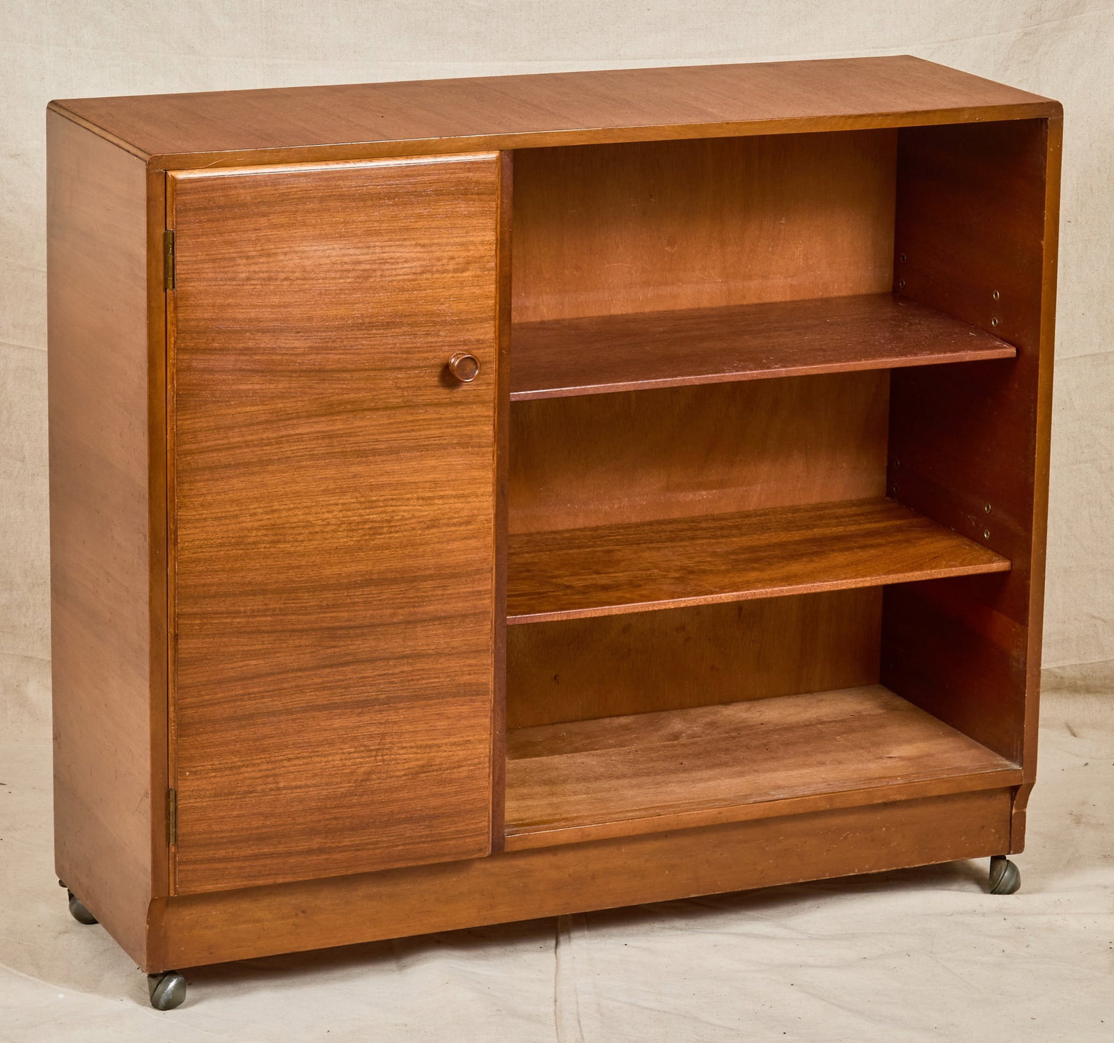CASTLE MID-CENTURY TEAK CABINET on CASTERS: With tracks for sliding glass doors. 32 x 36 x 12 inches.