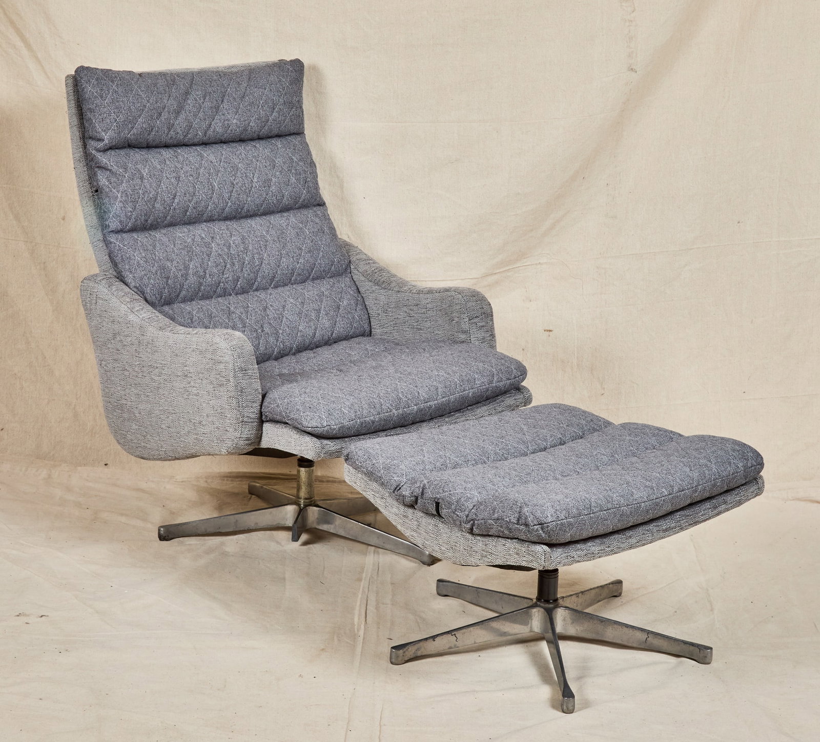 MINTY SWIVEL LOUNGE CHAIR & OTTOMAN: Plush gray upholstery. 38 x 27 x 30 inches.