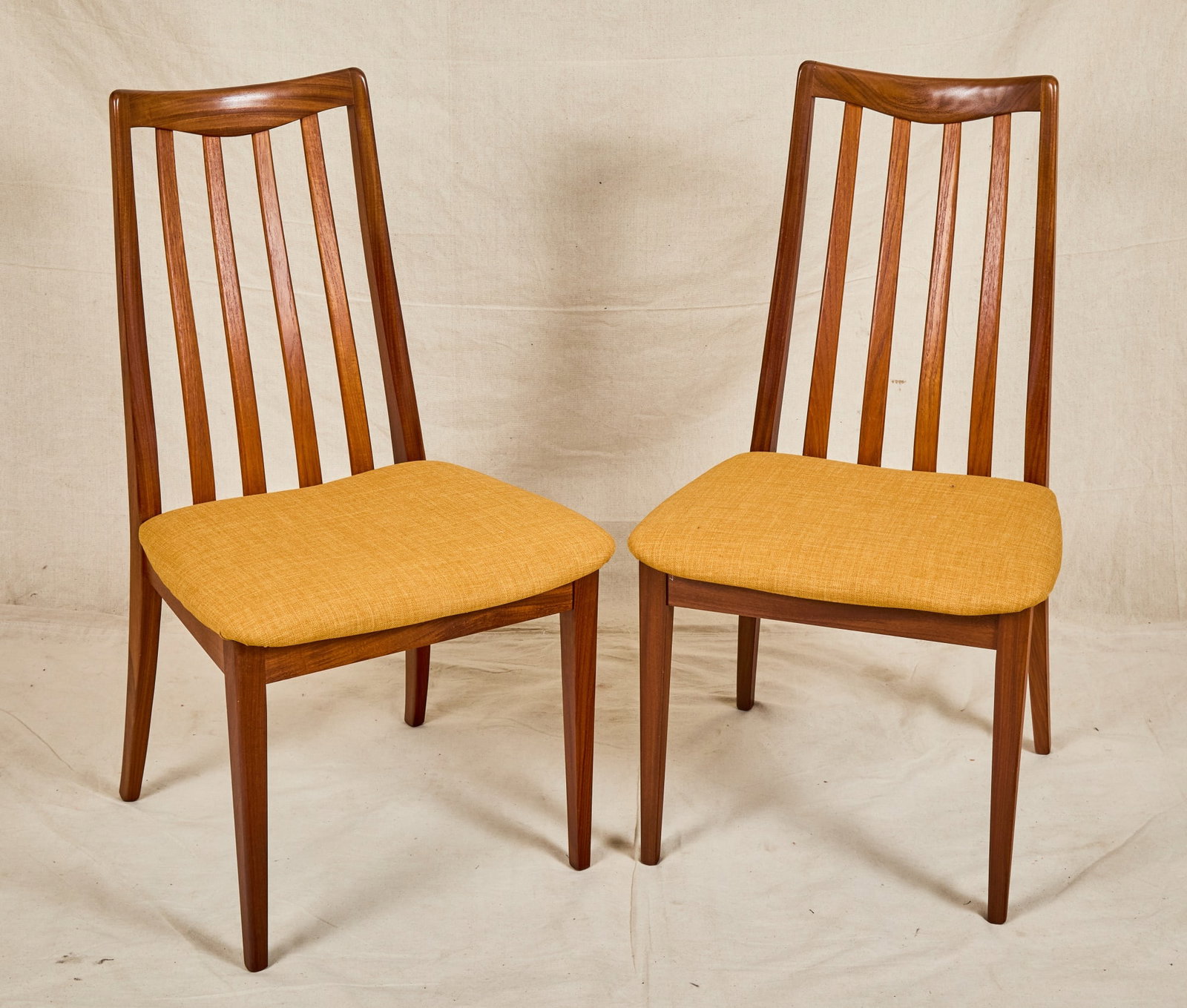 PAIR of G PLAN TEAK SIDE CHAIRS: With goldenrod upholstered seats. 35 x 19 x 17 inches.