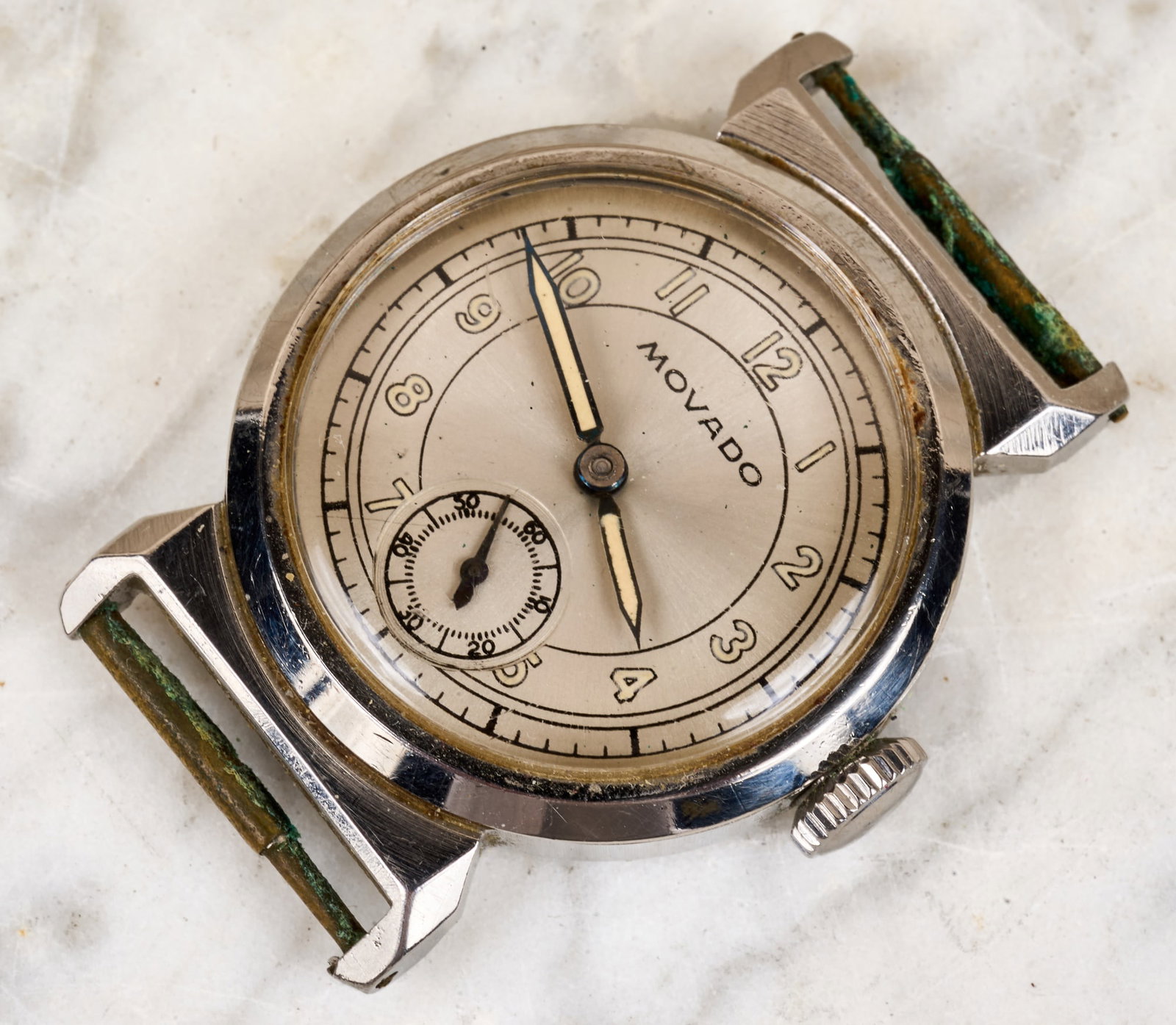 MOVADO MENS WRIST WATCH: On cloth band. Back cover inscribed "Cornelius Ayer Wood Jr., Andover, MA 6-11-37", his 17th birthday. 8 1/2 inches.