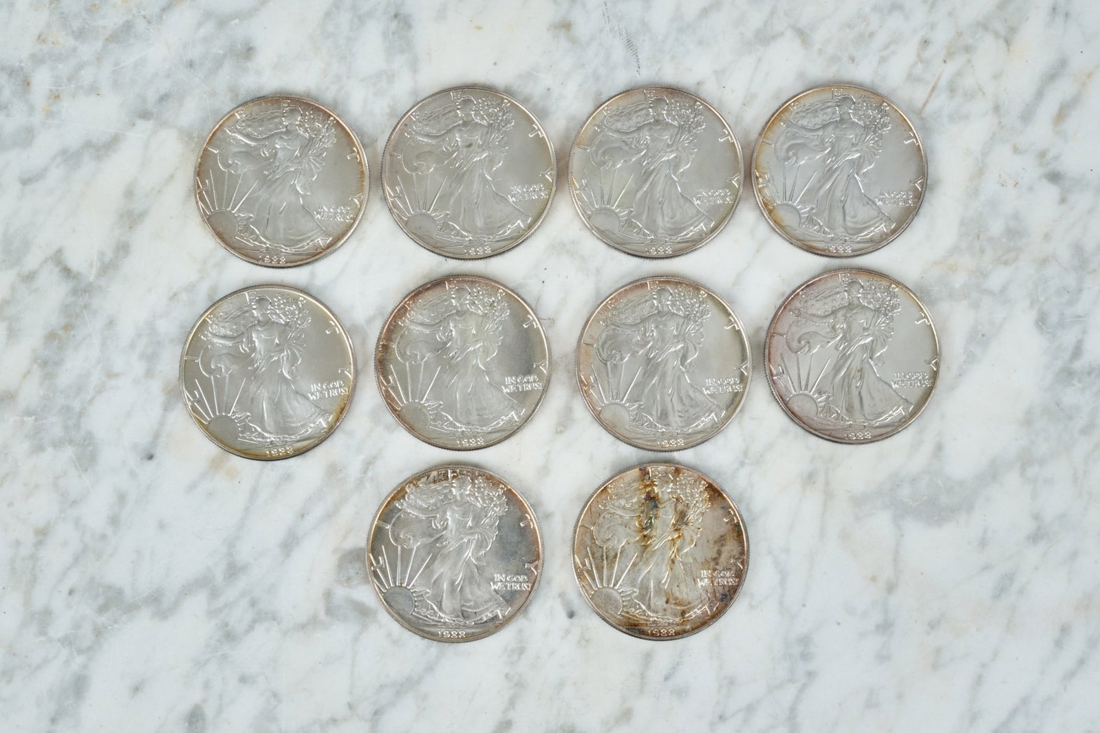 (10) 1988 SILVER AMERICAN EAGLE DOLLARS: (1) ozt fine silver each. Uncirculated. 1 1/2 inches.