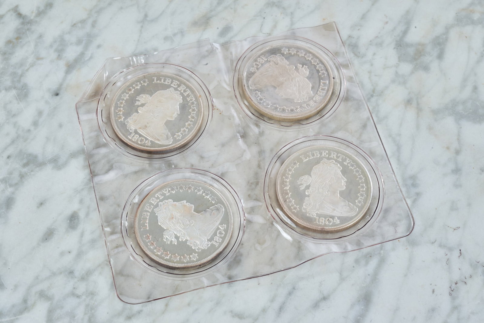 (4) 1804 DRAPED BUST SILVER DOLLAR COPIES: 1ozt .999 silver each.