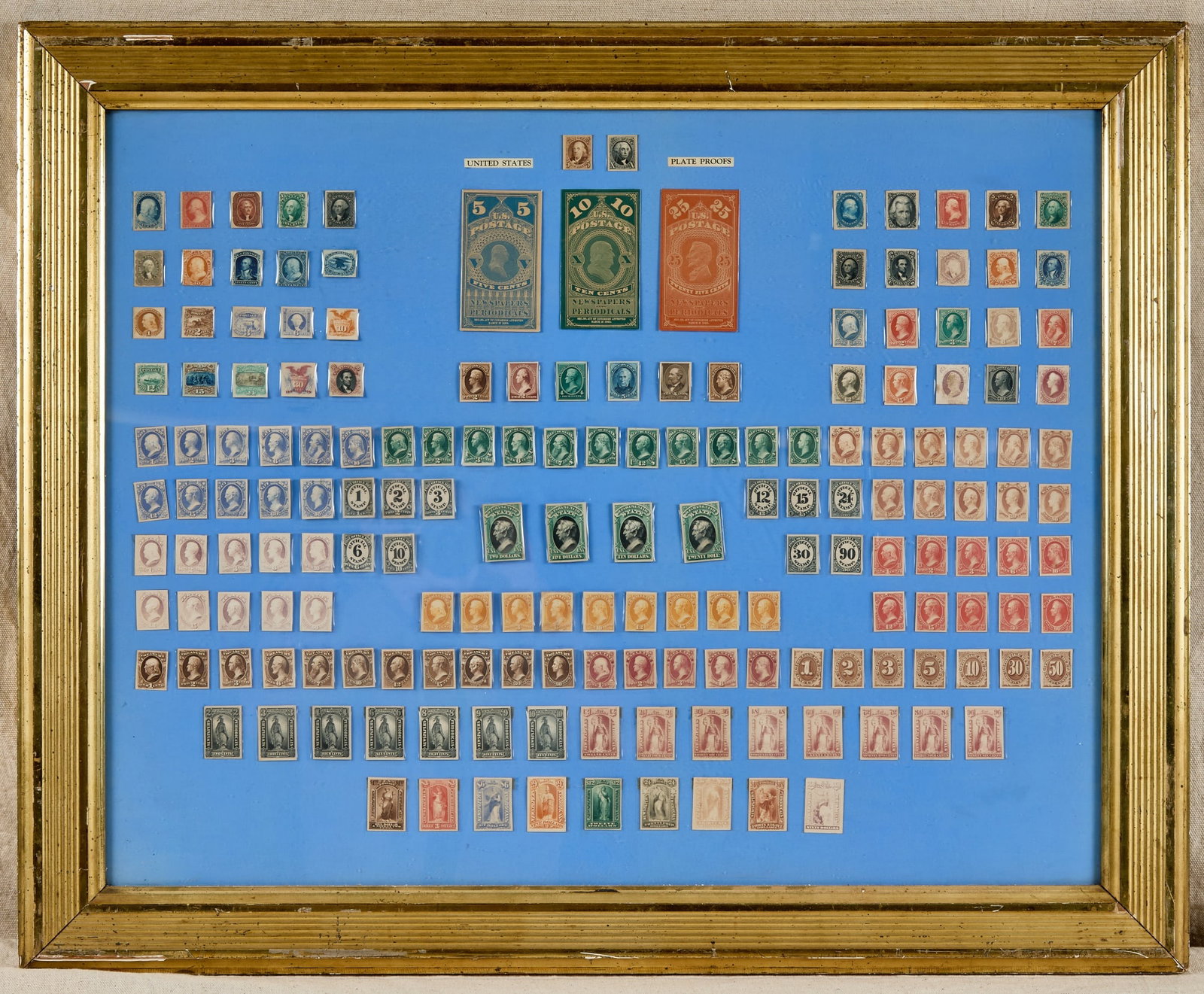 COLLECTION of 154 US STAMP PLATE PROOFS: Assembled and framed under glass in antique gold leaf frame in stamp leaves. Frames size 27 x 32 1/2 inches.