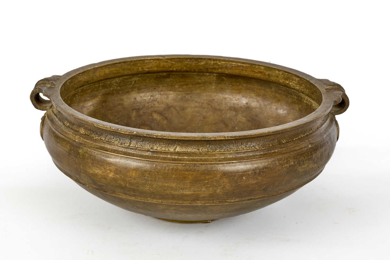 ANTIQUE INDIAN BRONZE URLI - CEREMONIAL BOWL: Antique Indian bronze urli used for preparation of ceremonial feasts & Ayurvedic medicines. (17th c) or later. Beautiful golden patina. 5 x 12 1/2 x 11 inches.