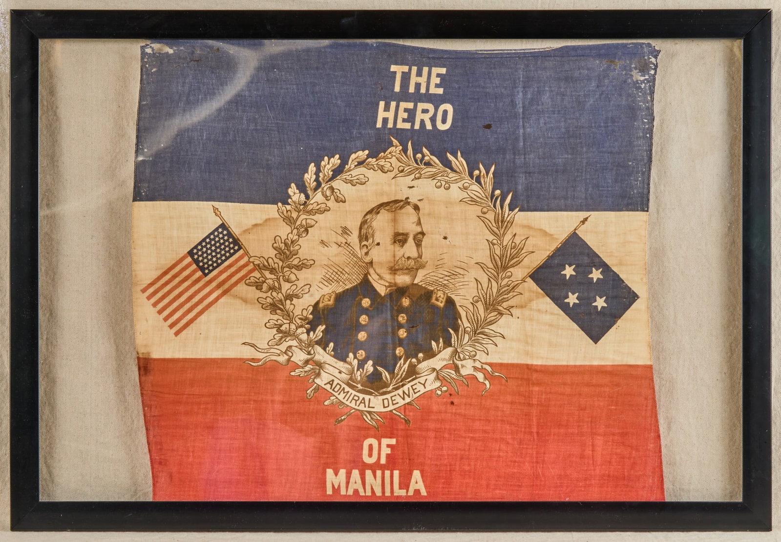 ADMIRAL DEWEY "THE HERO OF MANILA" BANNER: Patriotic banner celebrating Dewey's 1898 victory over the Spanish Fleet in The Battle of Manila Bay without a single loss of American life. Banner measures 23 x 25 5/8 inches. Overall 26 x 38 inches.