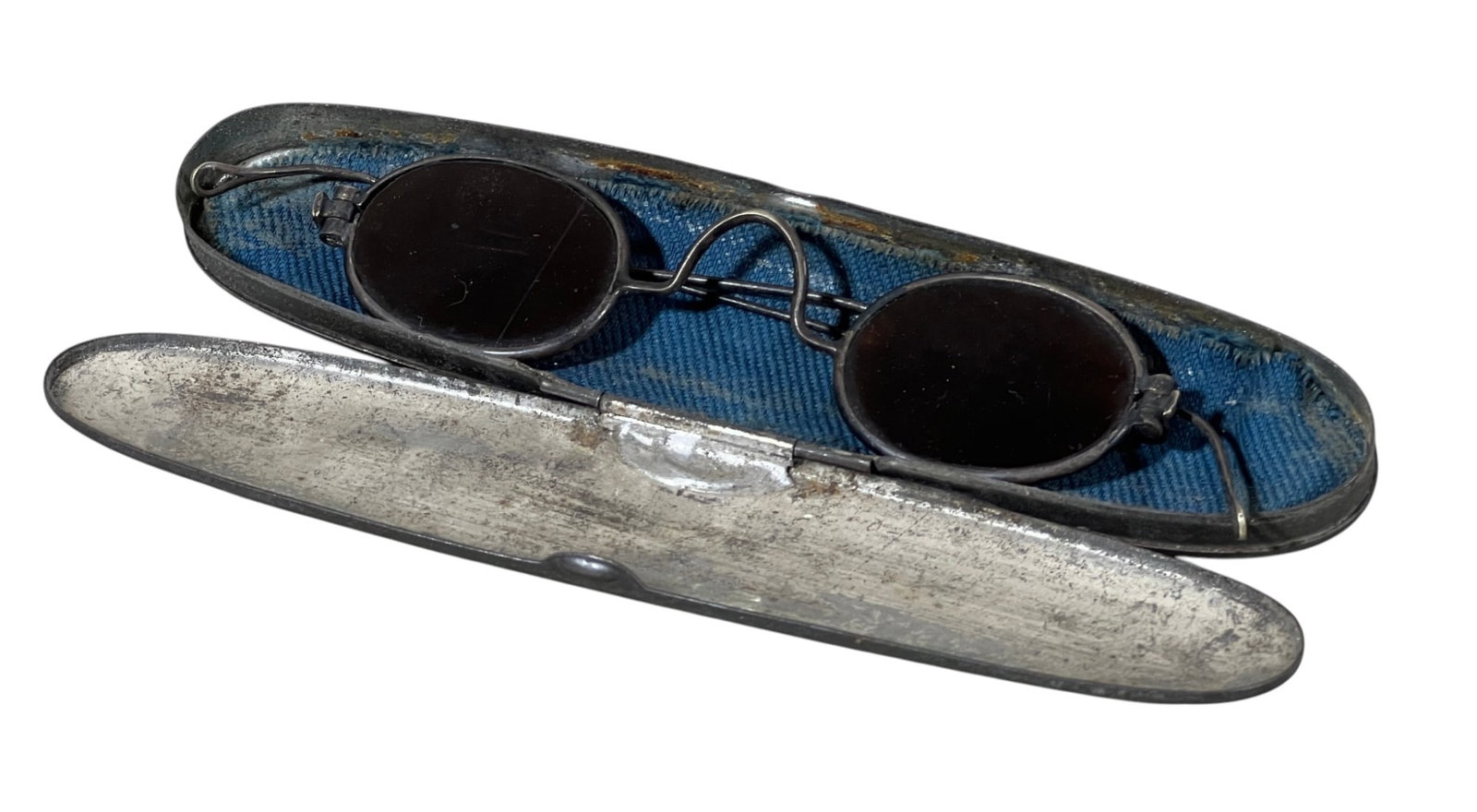 CIVIL WAR ERA SHARPSHOOTER/SUN GLASSES: Steel frames with frosted amber glass with a clear bullseye in the center for limiting glare. In original steel case. 4 inches.