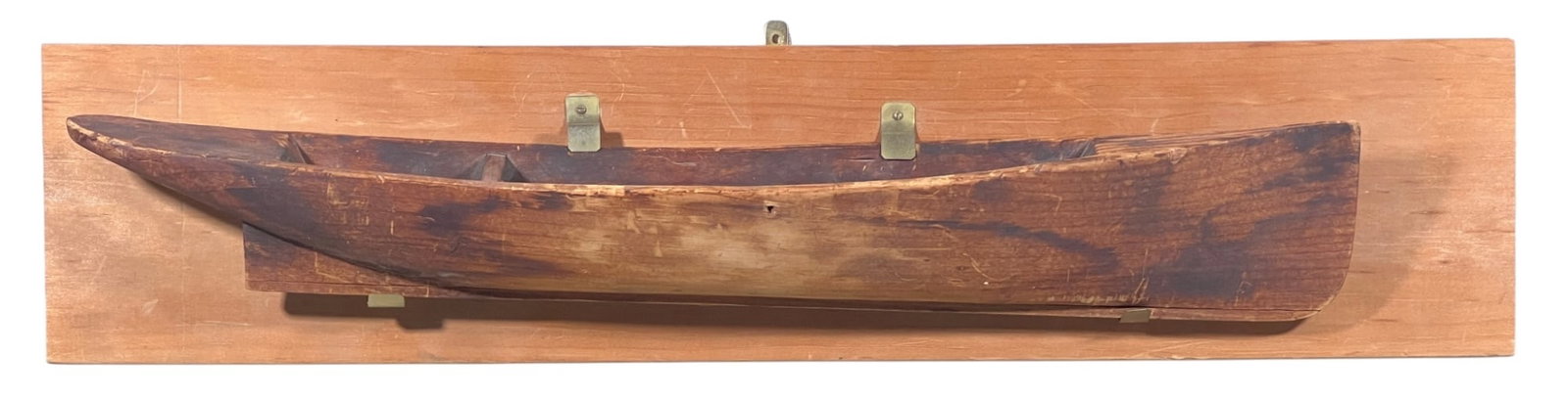 BOAT MODEL ALLEGEDLY HUNG in JH BELLAMY WORKSHOP: Carved pine model of a canoe with single seat & keel, mounted to a board. Inscribed verso "7-7-1965 Model gift from Monty Carlson of Kittery Pt. ME. Allegedly hanged in John H. Bellamy's Shop, given