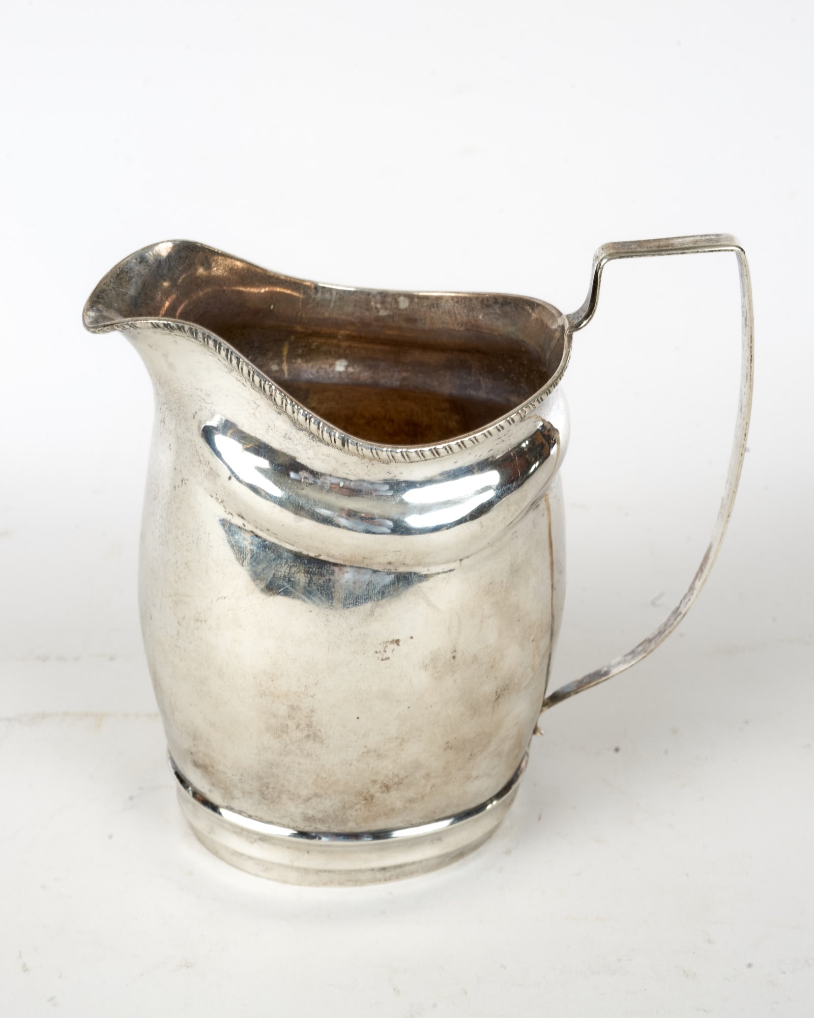 (18th/19th c) AMERICAN COIN SILVER CREAMER: (18th/19th c) American helmet form coin silver creamer, finely shaped. Unsigned. 5 1/2 inches. 5.77 ozt.
