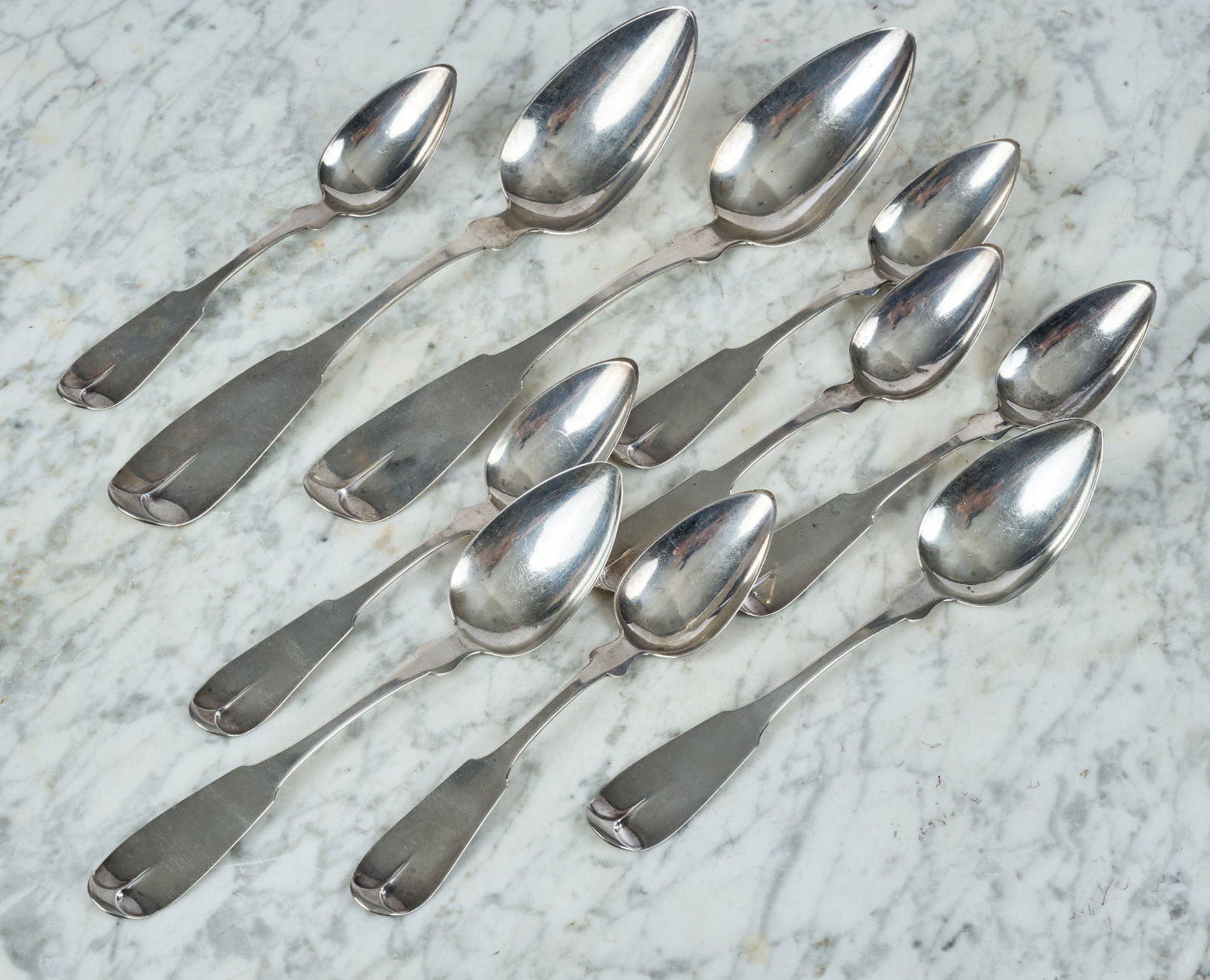 (10) J. MOULTON COIN SILVER SPOONS (NEWBURYPORT): Ten (19th c) coin silver spoons engraved "N.P. Eastman" by J. Moulton of Newburyport, MA. (2) 9 inch, (2) 7 inch, and (6) 6 1/4 inches. 7.77 ozt.