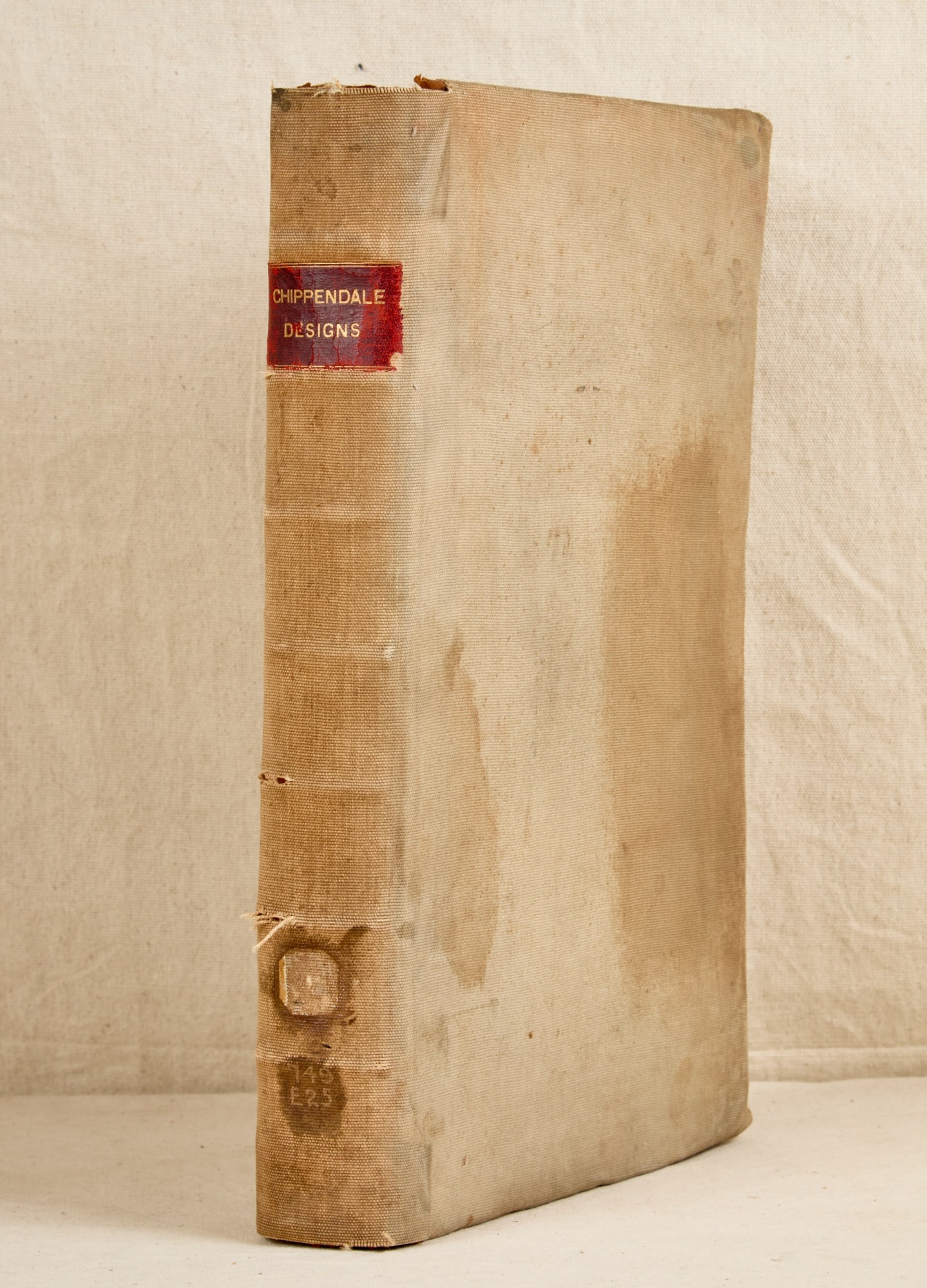THE GENTLEMAN & CABINET-MAKERS DIRECTOR 1754: The Gentleman and Cabinet-Makers Director by Thomas Chippendale dated 1754, cloth cover over leather binding. 18 x 12 x 2 1/2 inches.