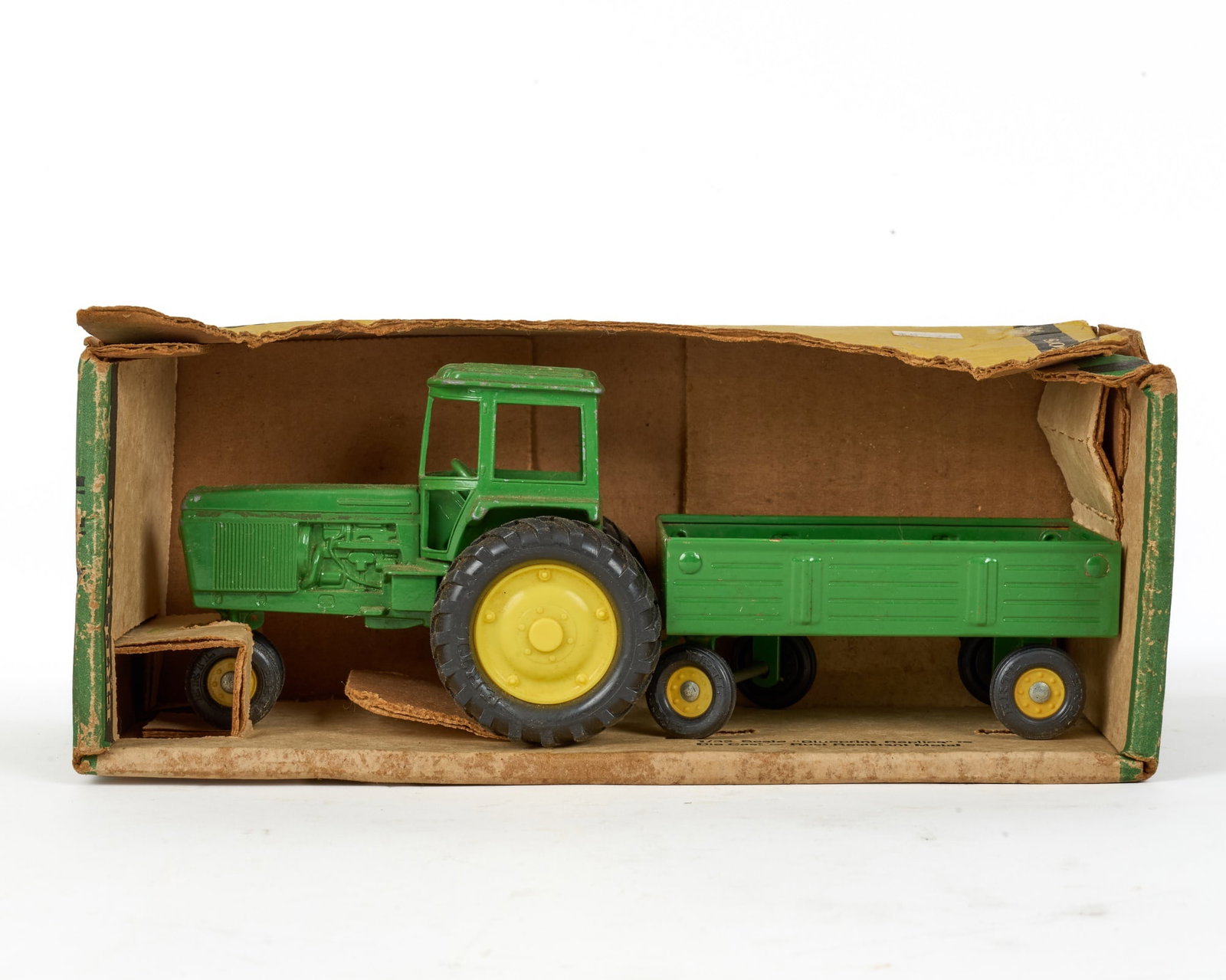 NEW IN BOX ERTL TOYS JOHN DEERE TRACTOR & WAGON: Ertl Toys 1/32 scale "Blueprint Replica" John Deere tractor & wagon in original packaging. Great shelf item. 5 1/2 x 10 1/2 x 4 1/2 inches.