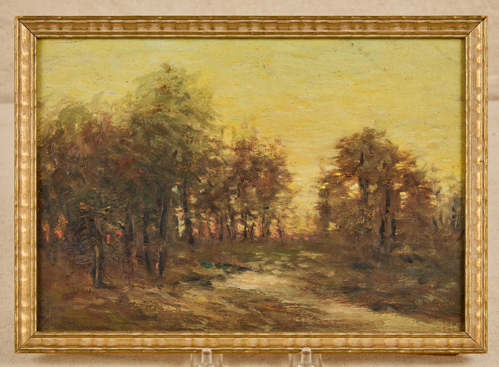 CHARLES BUCKLER (1869-1953): Trees at Dusk oil on board 7 x 10 inches. unsigned. framed 7 1/2 x 10 1/2 inches (overall). Provenance: By direct lineal descent from the artist to his great granddaughter (the consignor)