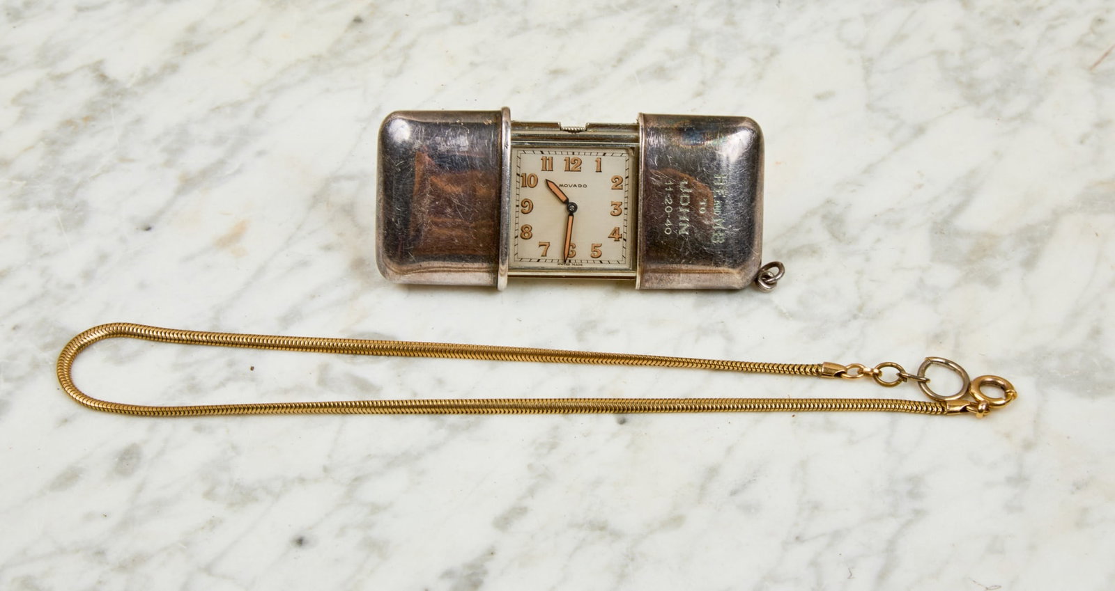 MOVADO TRAVEL CLOCK / POCKET WATCH: Serial #1238 149 M. 1 inch dial. 1 x 2 3/4 inches