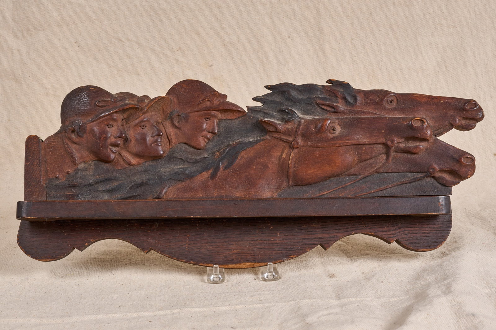 EARLY (20th c) CARVED WOODEN HORSE & JOCKEY PLAQUE: With a lower rack added later. Nice patina. 8 x 19 1/2 inches.