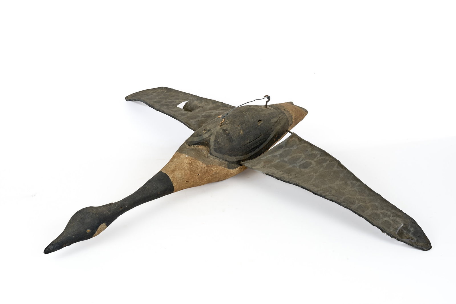 LARGE CARVED & PAINTED GOOSE with CANVAS WINGS: Early (20th c) carved & painted folk art Canada goose with painted canvas wings. Possibly used as a trade sign. 6 x 41 x 32 inches.