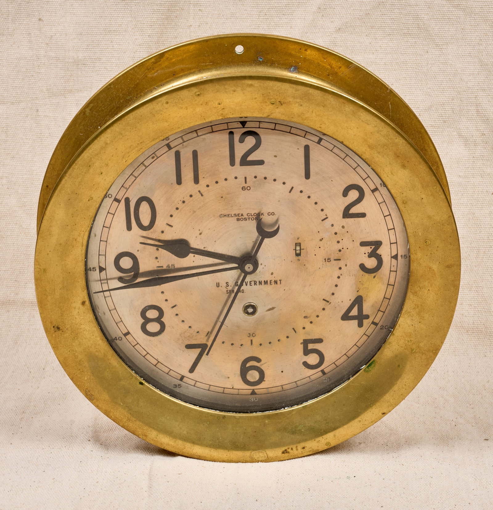 US AIR FORCE BRASS CHELSEA CLOCK: 10 inch brass case, 8 1/2 inch engraved silver dial with U.S. Government mark, engraved plaque verso: Air Force Stock no. 8TAA-220000, MFG. Nov. 1954, CCC -Part no. 20544, contract no. N383s-4122A, se