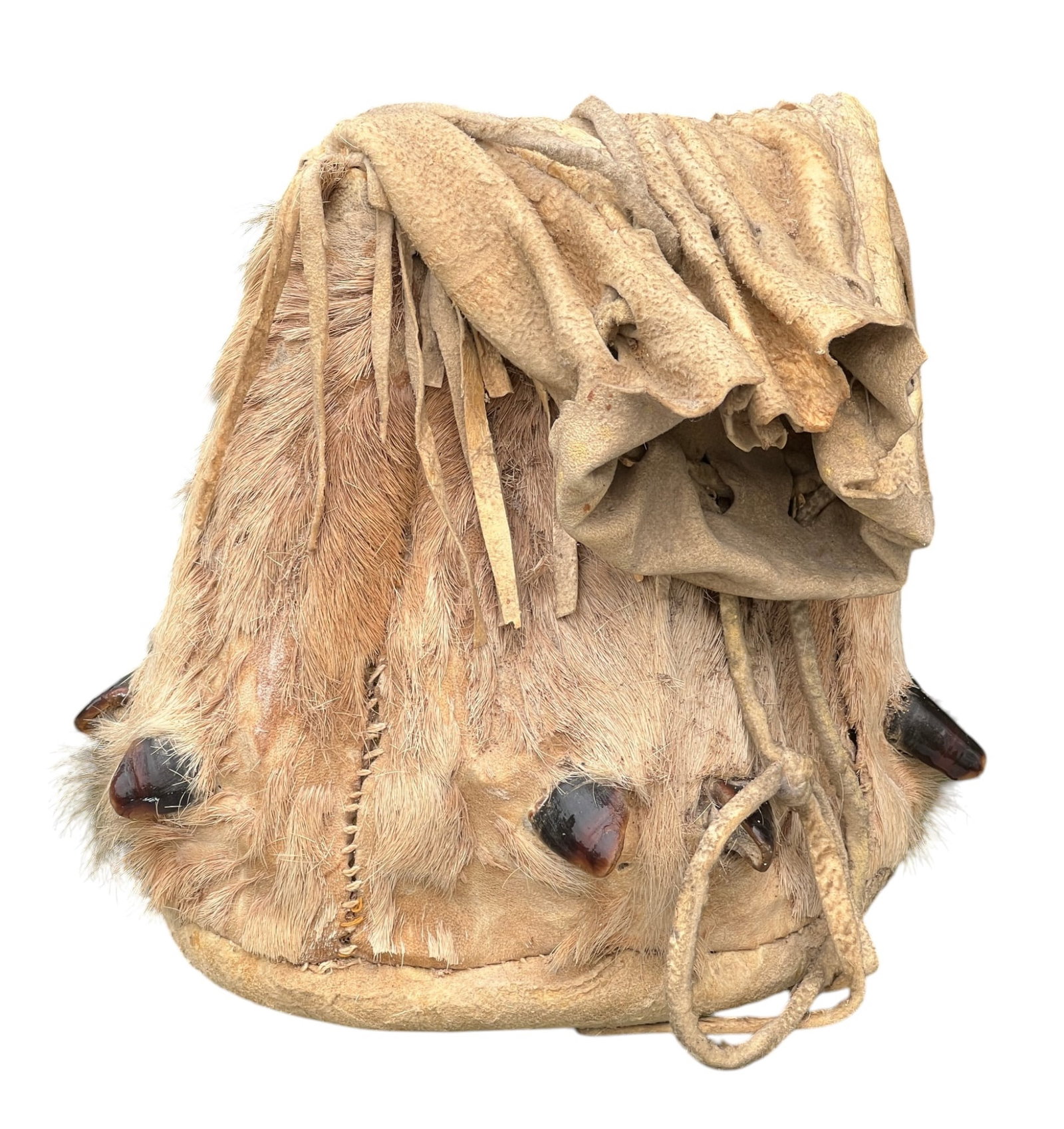 NATIVE AMERICAN DEWCLAW BAG: Fringed buckskin bag with natural deer/elk fur & dewclaws, filled with wood shavings. 10 x 6 inches.