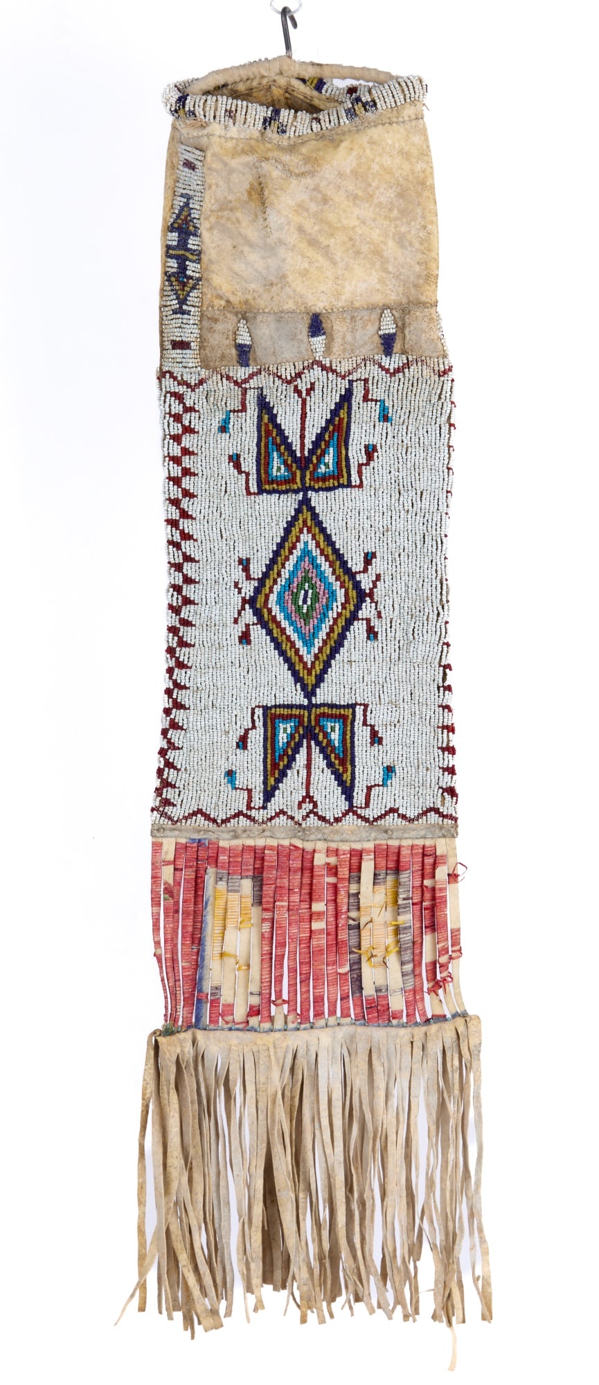 PLAINS INDIANS PIPE BAG w EXTENSIVE BEADWORK: Plains Indians rawhide/buckskin pipe bag with extensive geometric polychrome beadwork & quill wrapped fringe. 25 x 6 inches.