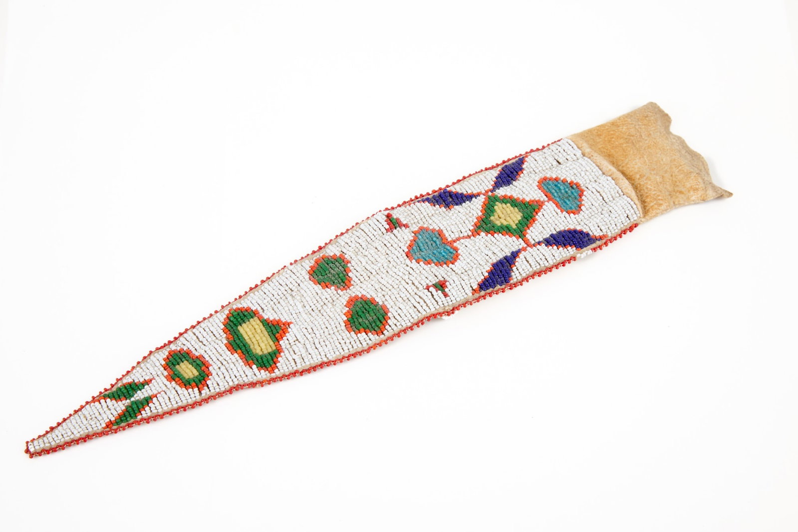 PLAINS INDIANS BEADWORK KNIFE SHEATH: Plains Indians buckskin knife sheath with extensive geometric polychrome beadwork including stylized flora. 13 1/2 inches.