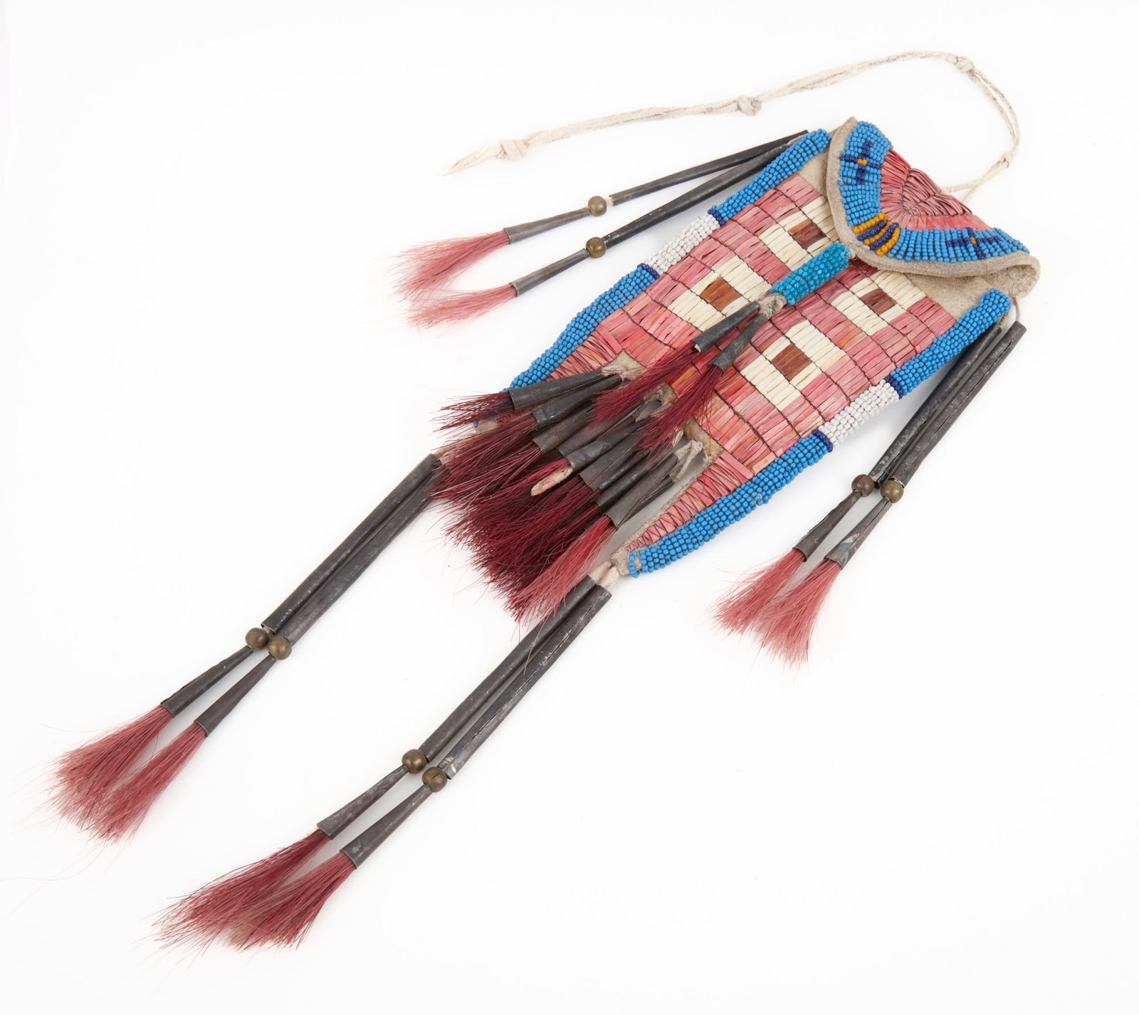 NATIVE AMERICAN STRIKE A LIGHT BAG w QUILL & BEAD: Native American buckskin strike-a-light bag with geometric polychrome quill & beadwork, tin cone & brass ball tassels with dyed horsehair, with original wrought iron striker. 13 x 4 inches.