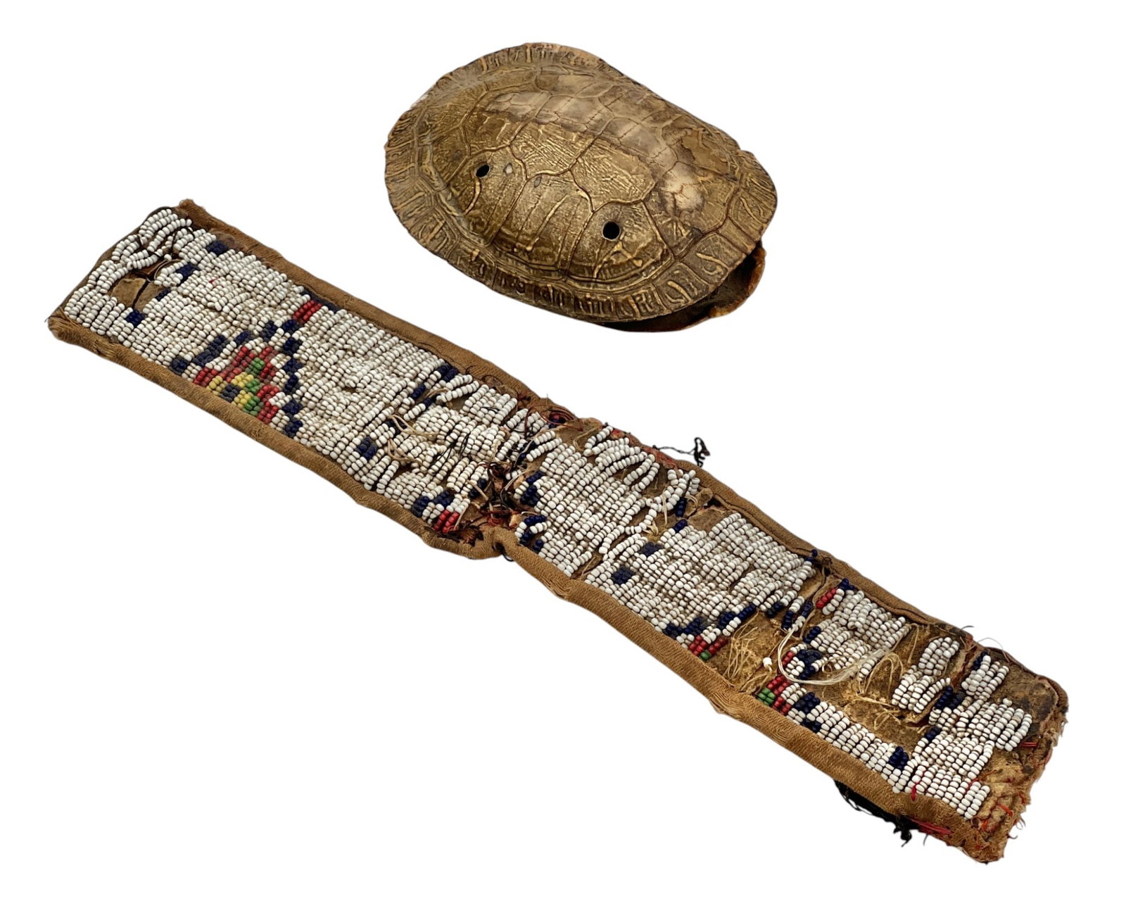 NATIVE AMERICAN BEADWORK FRAGMENT & TURTLE SHELL: Geometric polychrome beadwork collar/fragment on a leather & cotton base and a turtle shell percussion instrument. 11 inches.