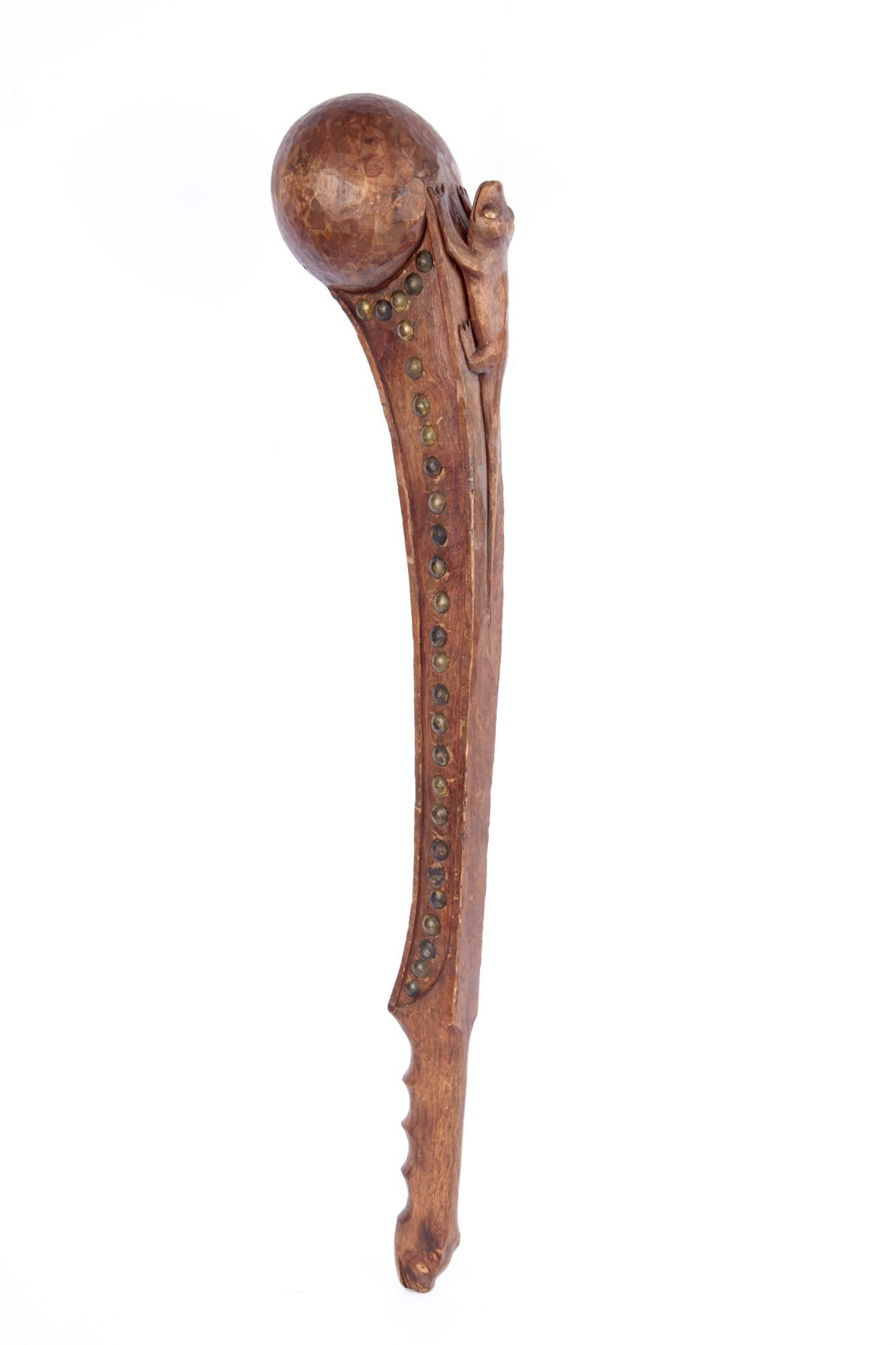 ZOOMORPHIC NATIVE AMERICAN BALL HEADED WAR CLUB: Native American carved wooden ball headed war club with brass tacks, lizard figure with brass tack eyes, and bear head handle. 22 1/2 inches.
