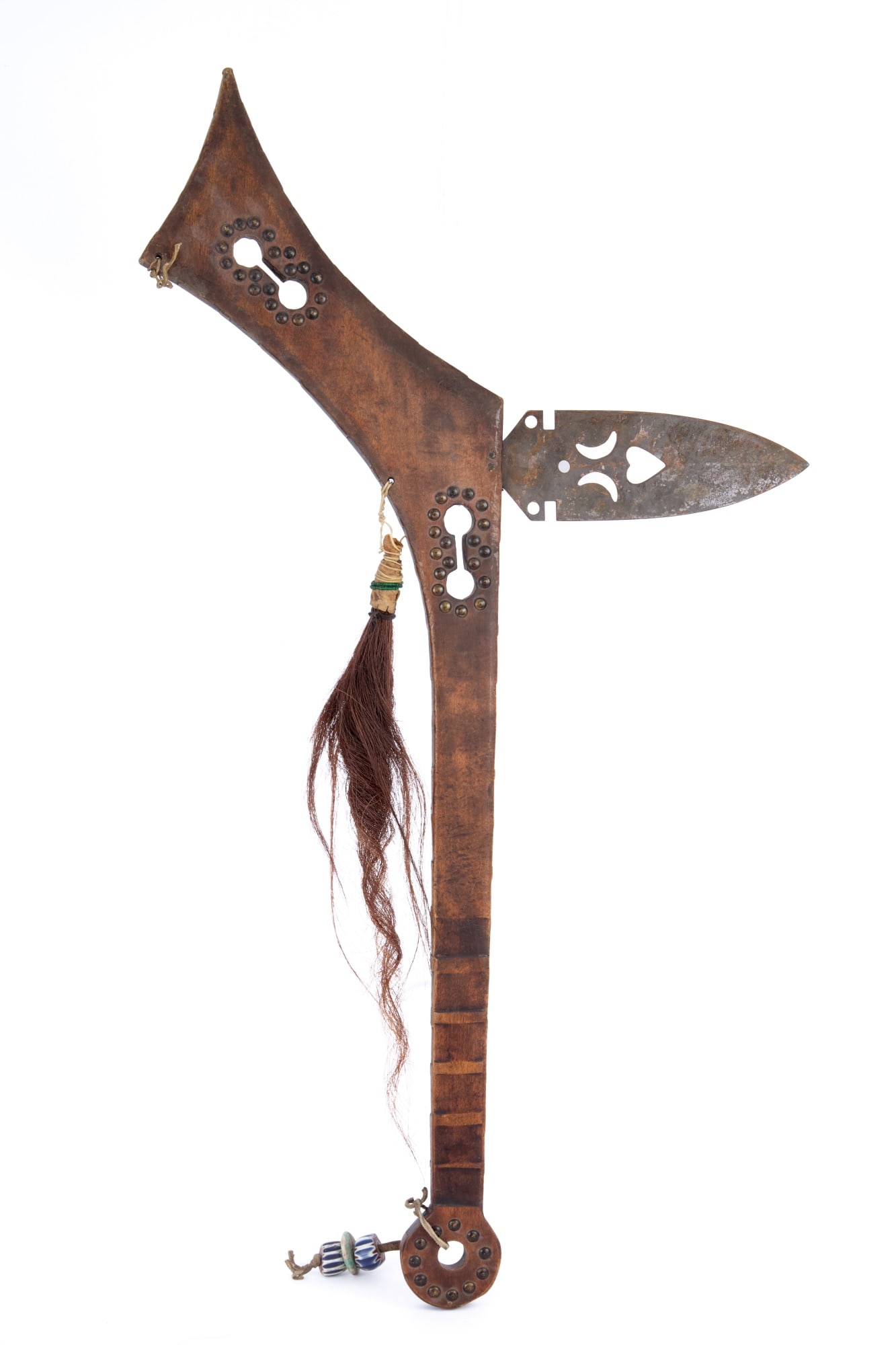 PLAINS INDIANS GUNSTOCK SPONTOON WAR CLUB: Wooden gunstock form handle with dumbbell piercing & brass tacks, notched grip, spontoon blade with pierced heart & crescents, horsehair & beadwork tassel, trade bead & turquoise disk handle charm. 31
