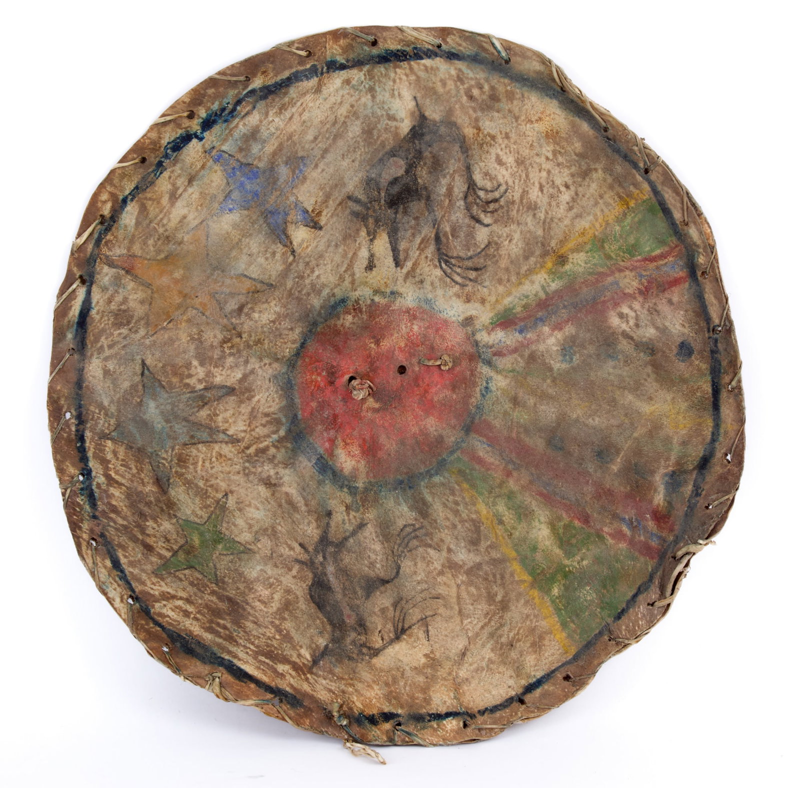 SOUTHWEST/PLAINS INDIANS PAINTED RAWHIDE SHIELD: (19th c) Southwest/Plains Indians rawhide shield painted with (2) opposing coyotes under the stars howling at a blood moon/eclipse with expanding polychrome rays below. 18 1/2 inches.
