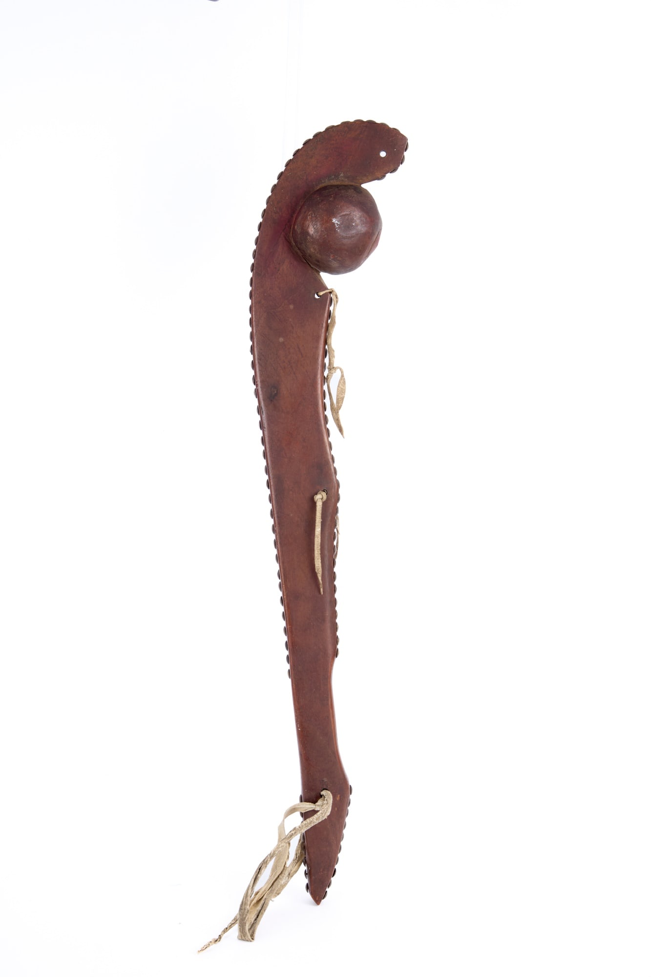PLAINS INDIANS BALL HEAD WAR CLUB: Carved wooden handle with brass trade tack decoration. 27 inches.