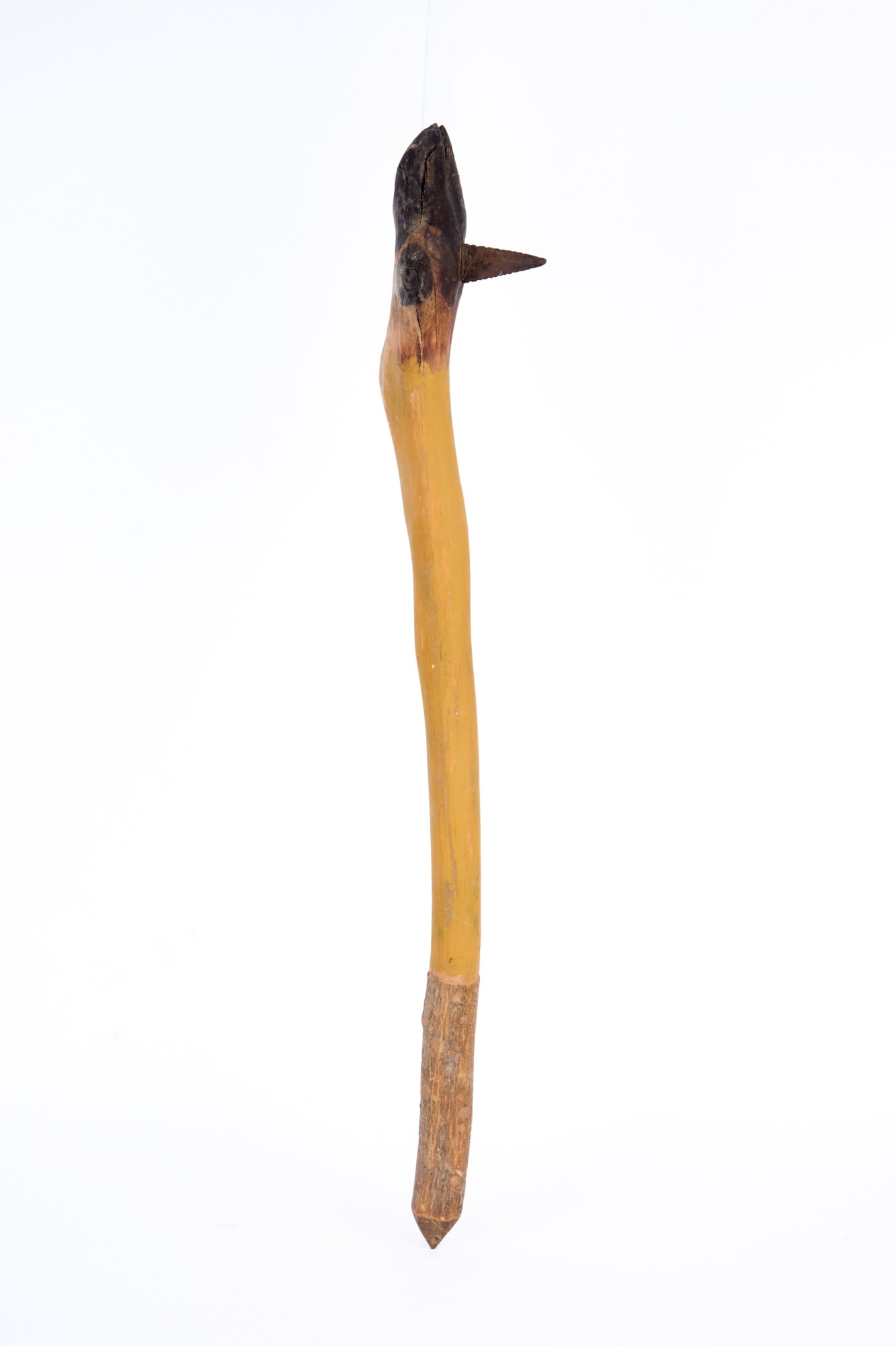 NATIVE AMERICAN CARVED & PAINTED DEER LEG WAR CLUB: Native American carved & painted wooden war club in the form of a deer leg with serrated arrowhead like iron blade, natural bark grip, pointed tip. 23 1/4 inches.