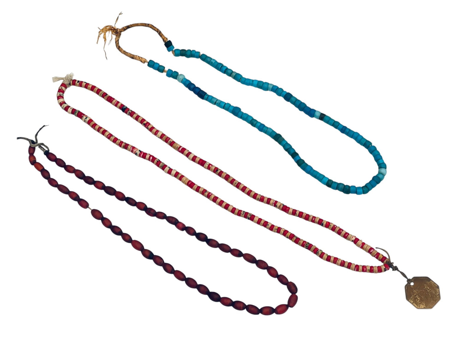 (3) ANTIQUE NATIVE AMERICAN TRADE BEAD NECKLACES: Venetian white heart, glass turquoise beads and red & white Murano beads with brass Fort Ligonier medallion. 16 1/4 inches.